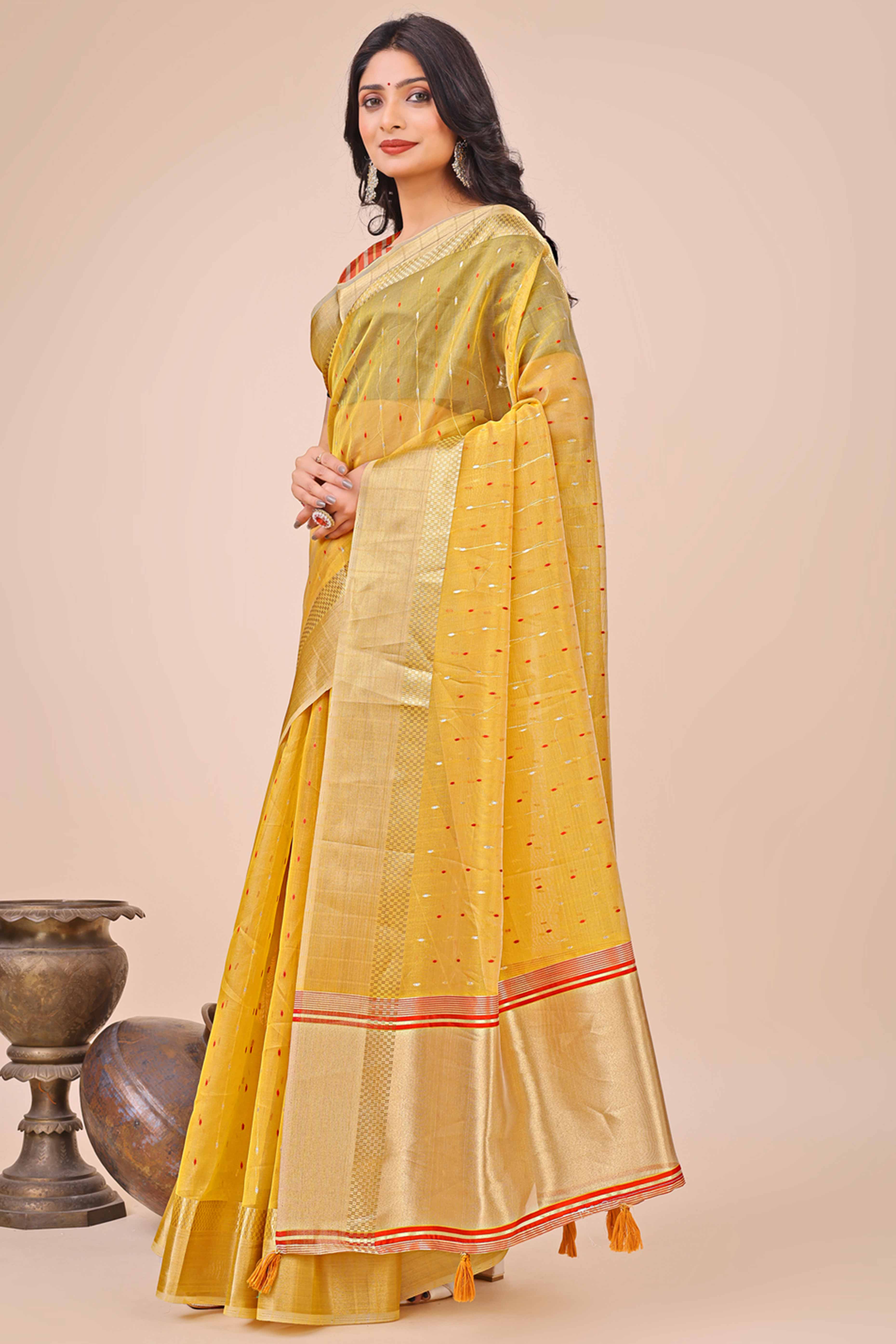Yellow Organza Saree Adorned With Fine Zari Weaving & Stylish Tassel Edging