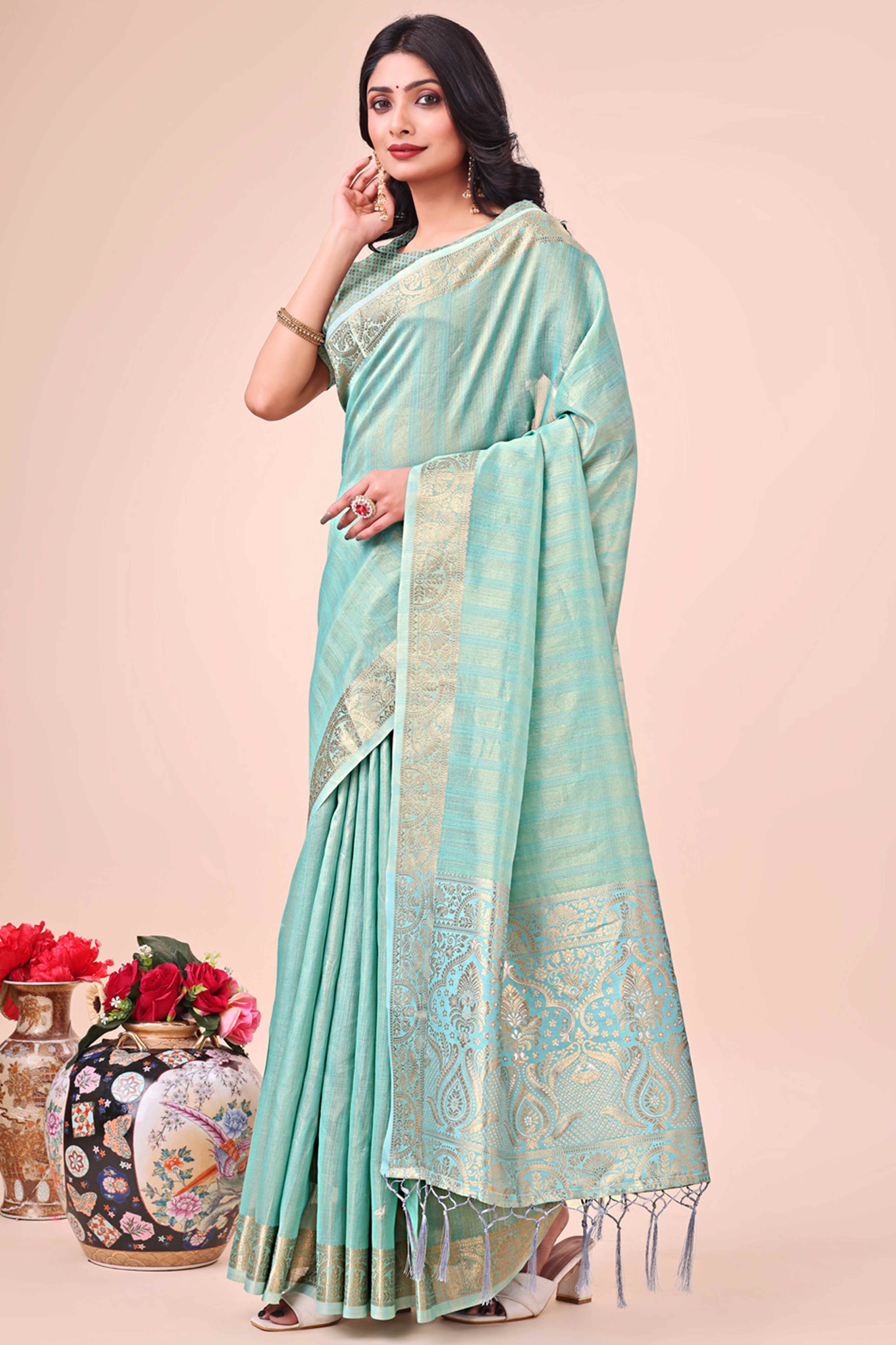 Turquoise Organza Saree With Floral Zari Weave & Tassel Accents