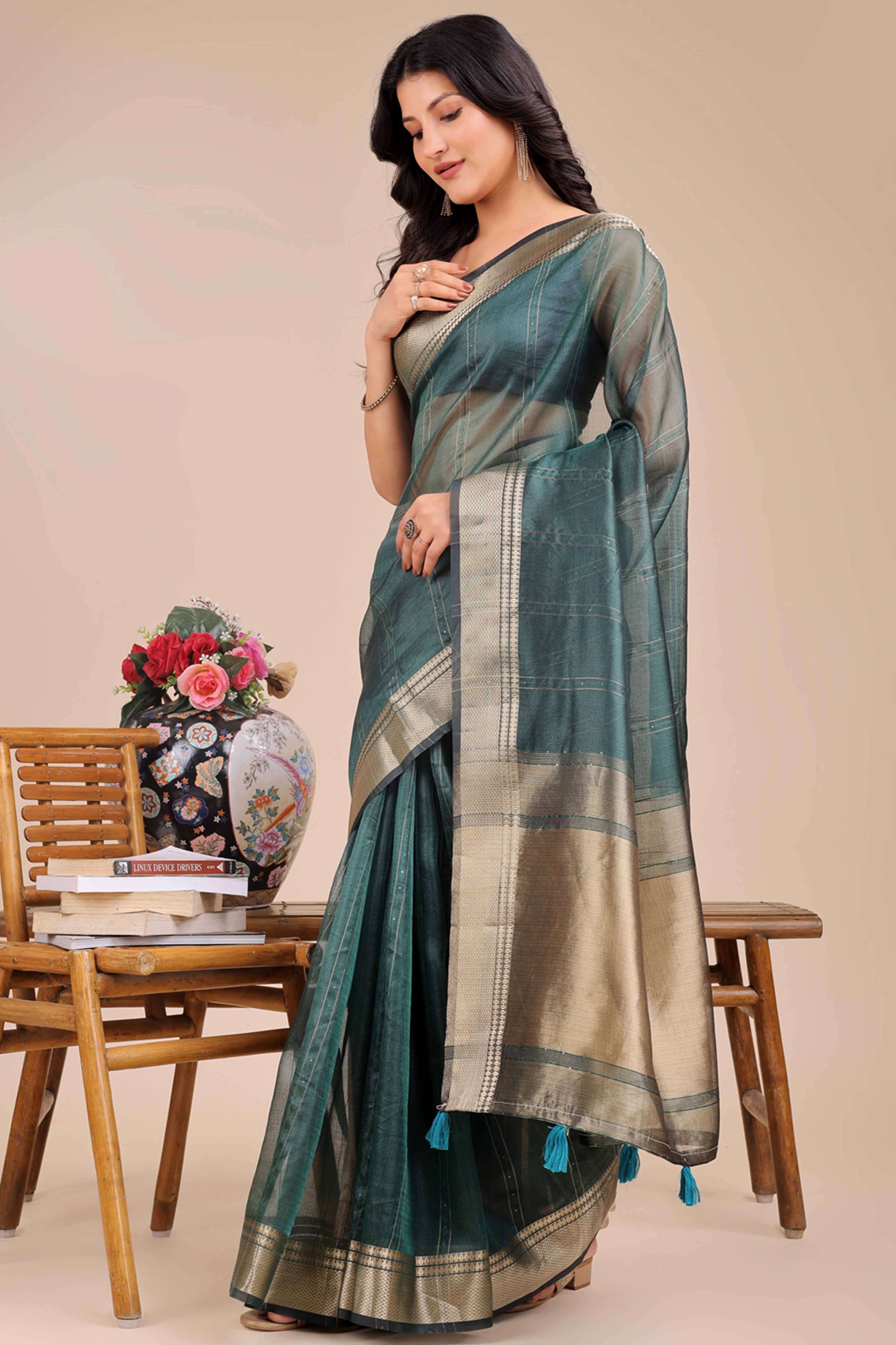 Dark Green Hue Organza Saree with Shimmering Zari Border Weave