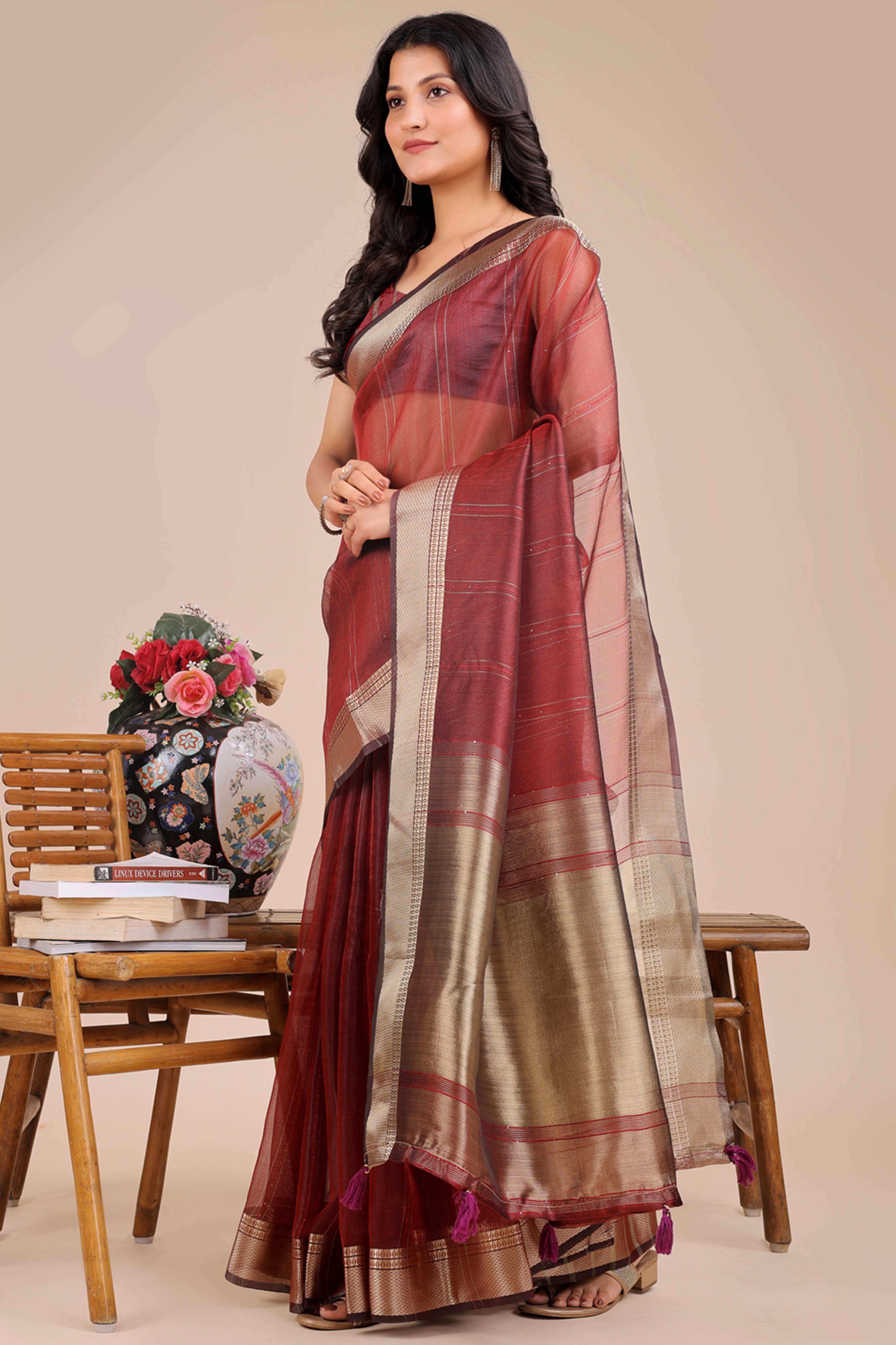 Maroon Hue Organza Saree with Shimmering Zari Border Weave