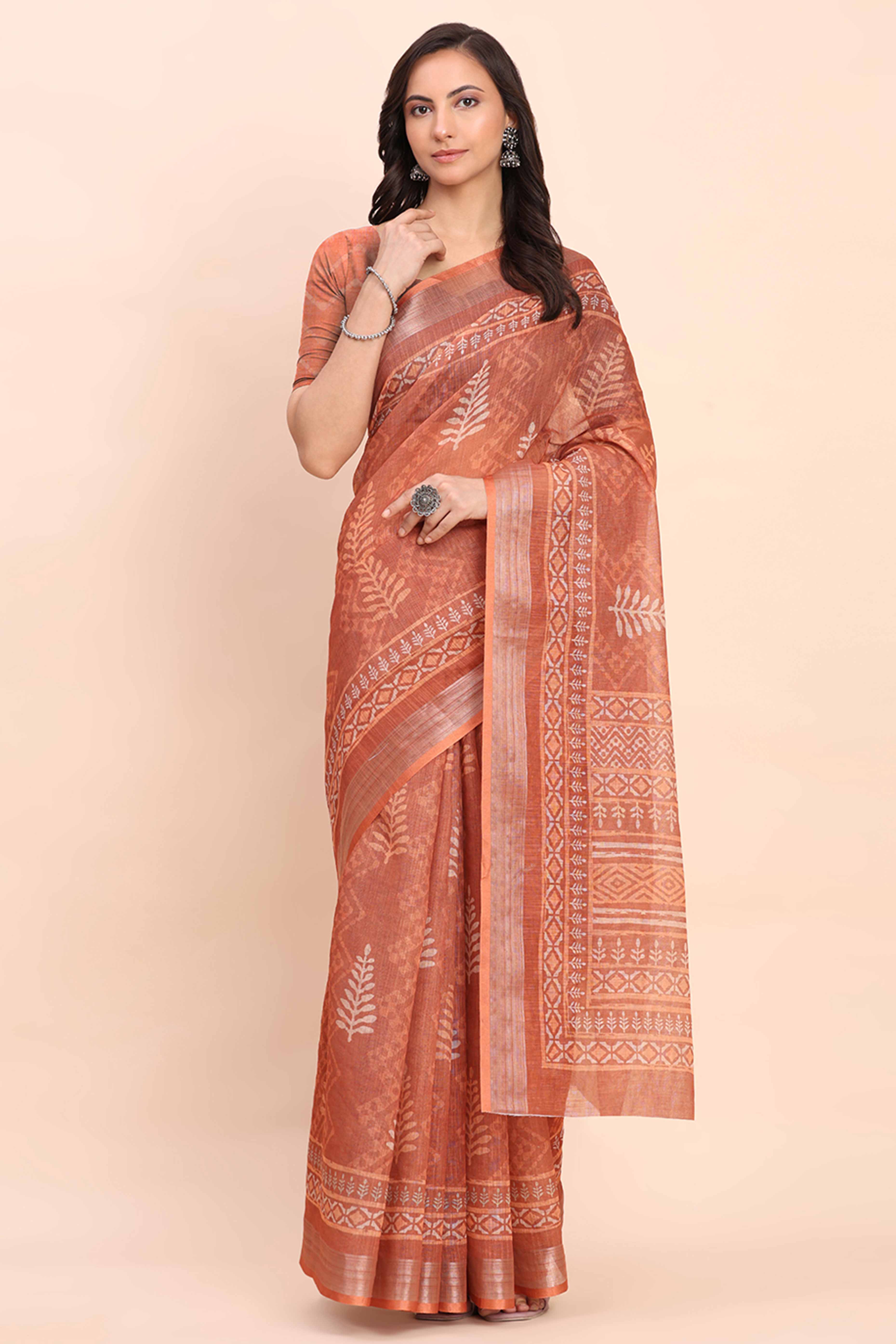Rust Linen Saree with Intricate Silver Weaving