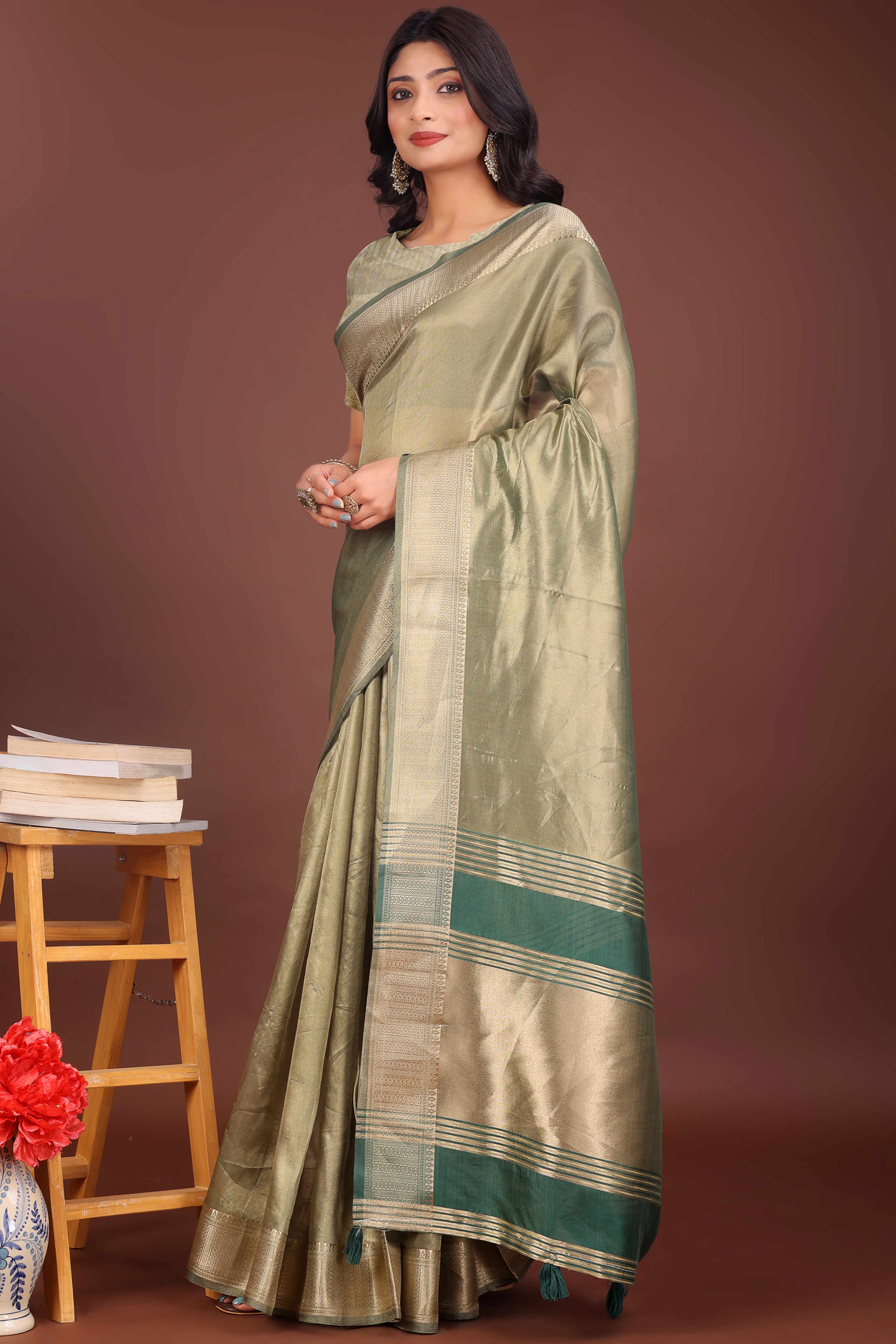 Green Organza Solid Saree With Lustrous Zari Weave &  Delicate Tassels