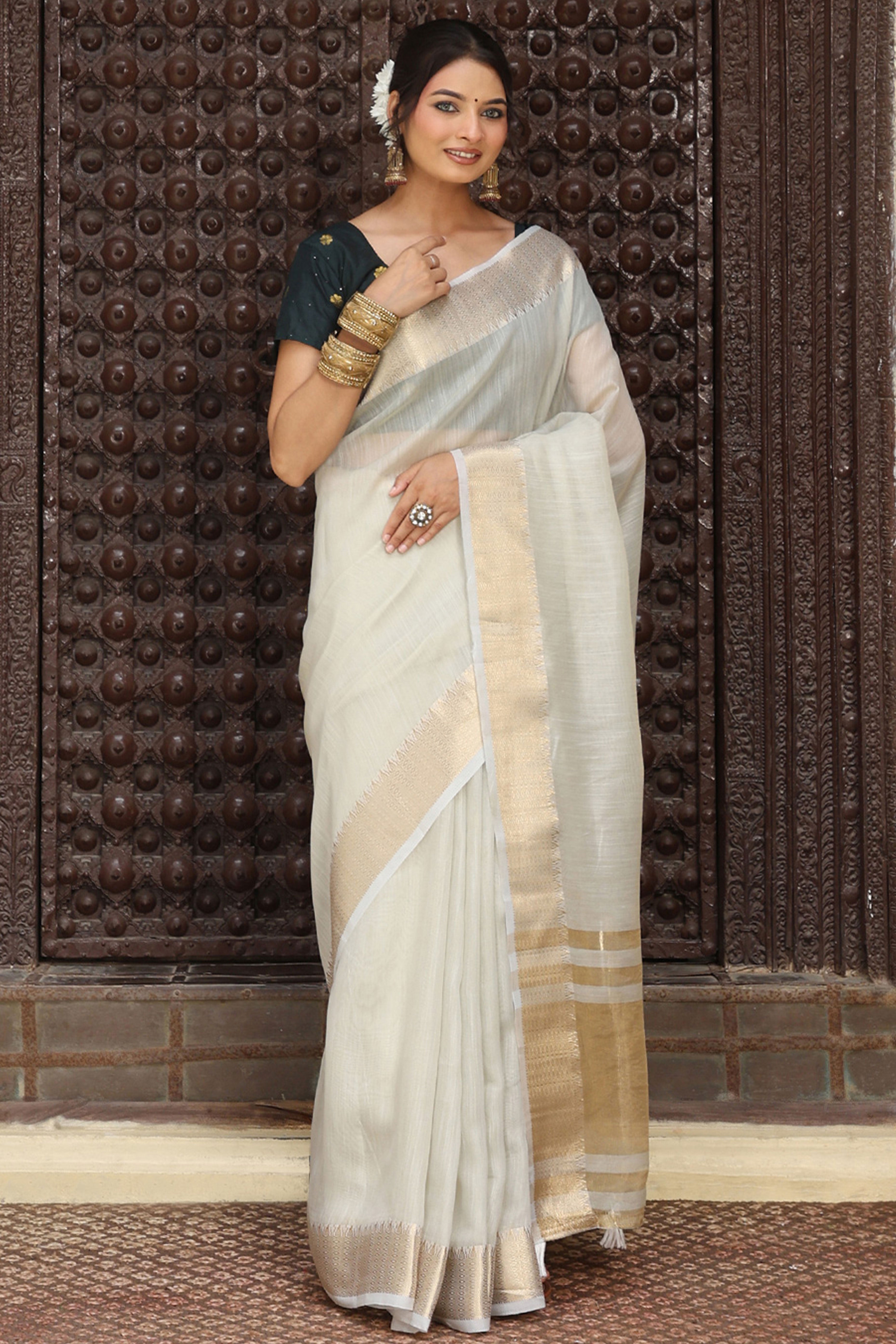 Charming Grey Zari Weaving Cotton Blend Saree Adorned With Stylish Tassel Detailing