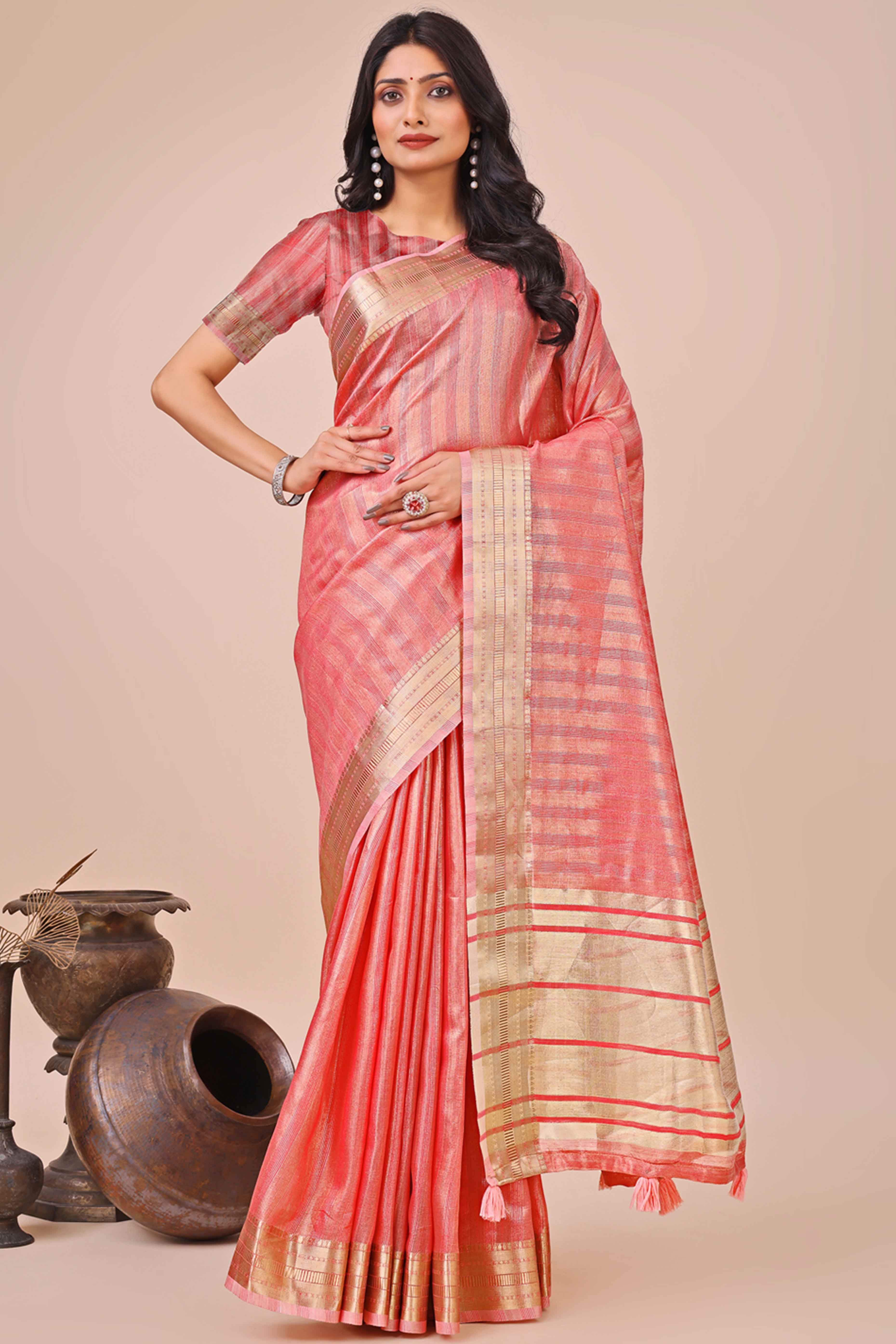 Coral Pink Organza Saree With Intricate Weave & Elegant Tassel Accents