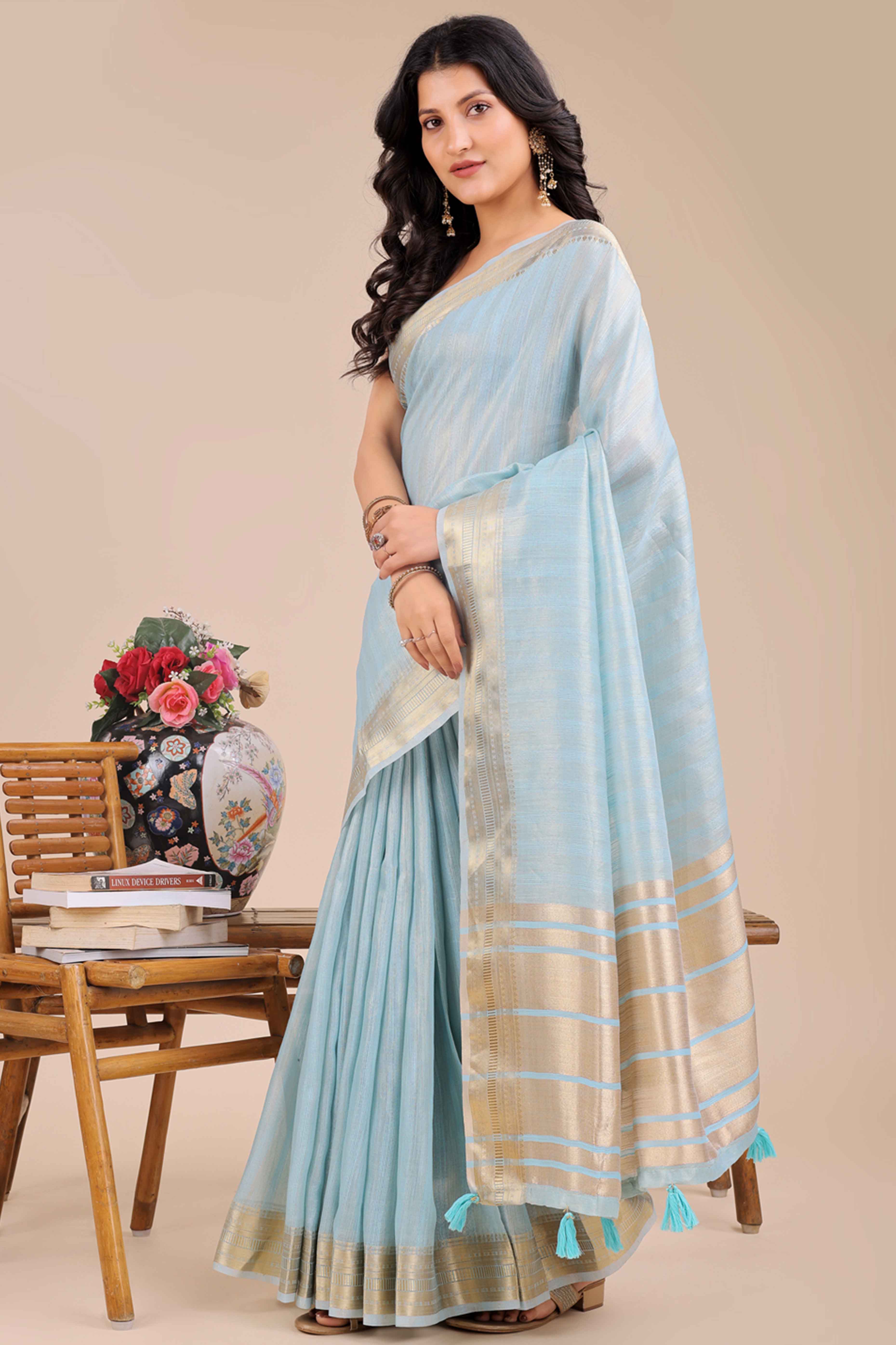 Sky Blue Organza Saree With Intricate Weave & Elegant Tassel Accents