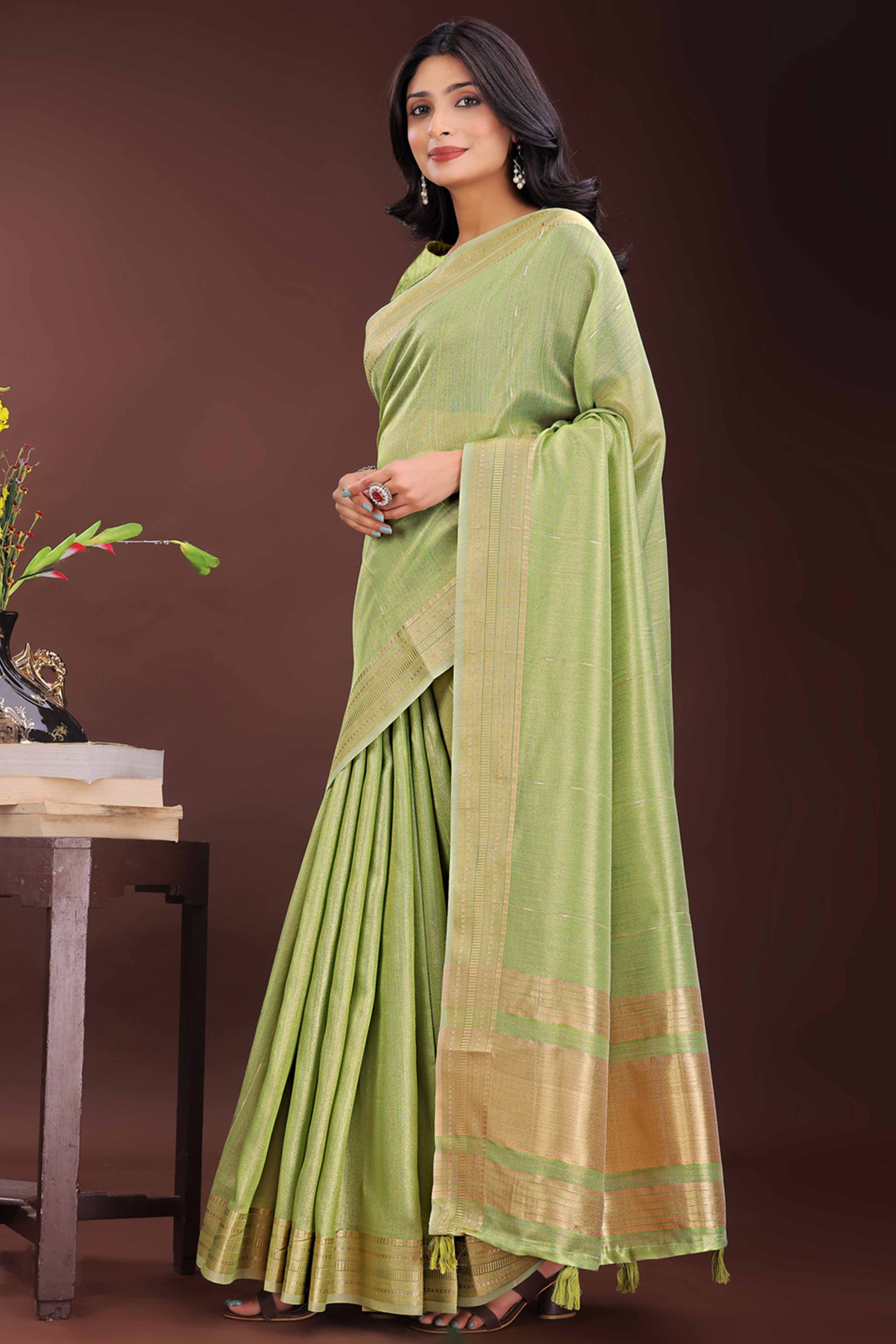 Green Organza Saree Adorned With Zari Weave & Tassel Edges