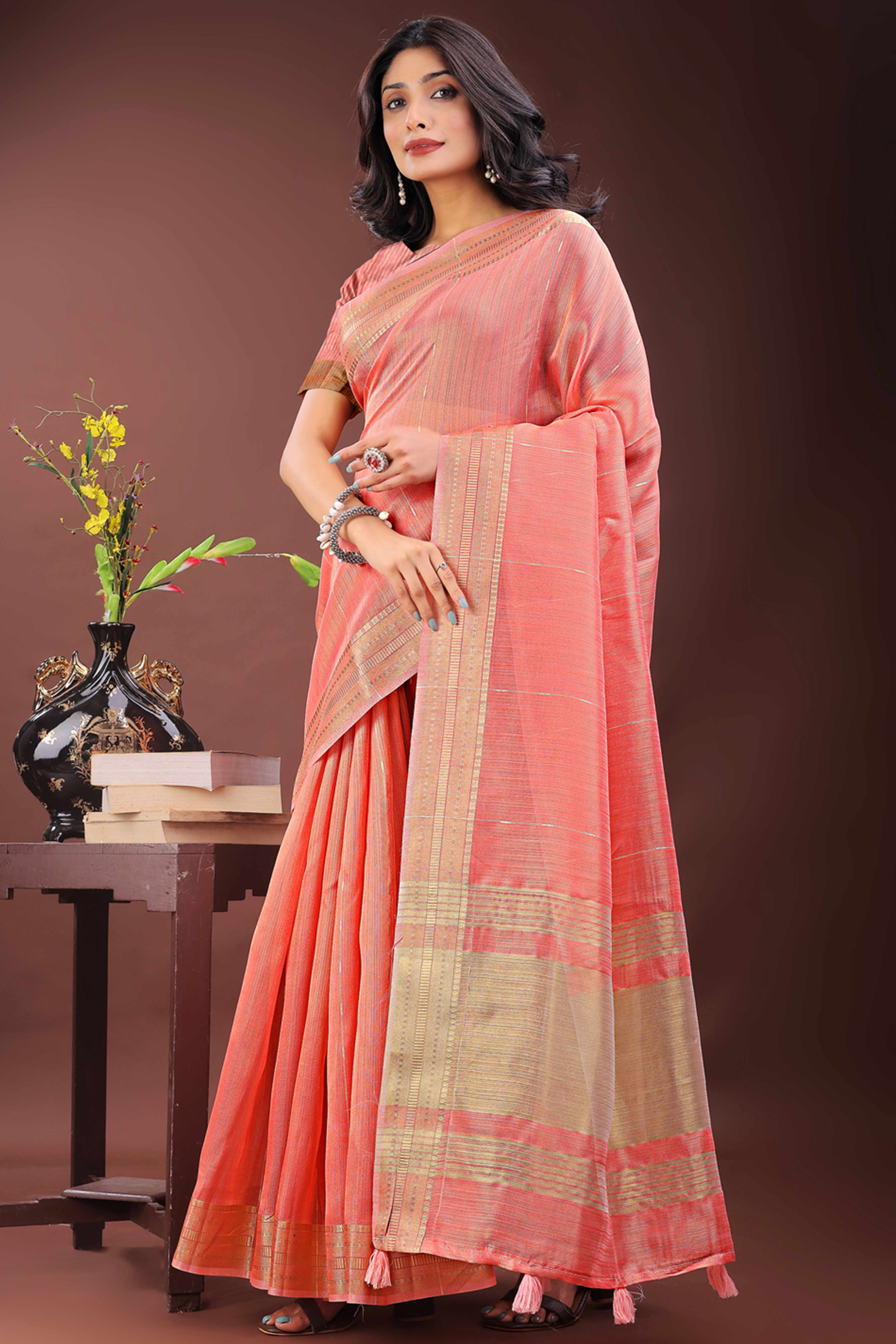 Coral Pink Organza Saree Adorned With Zari Weave & Tassel Edges