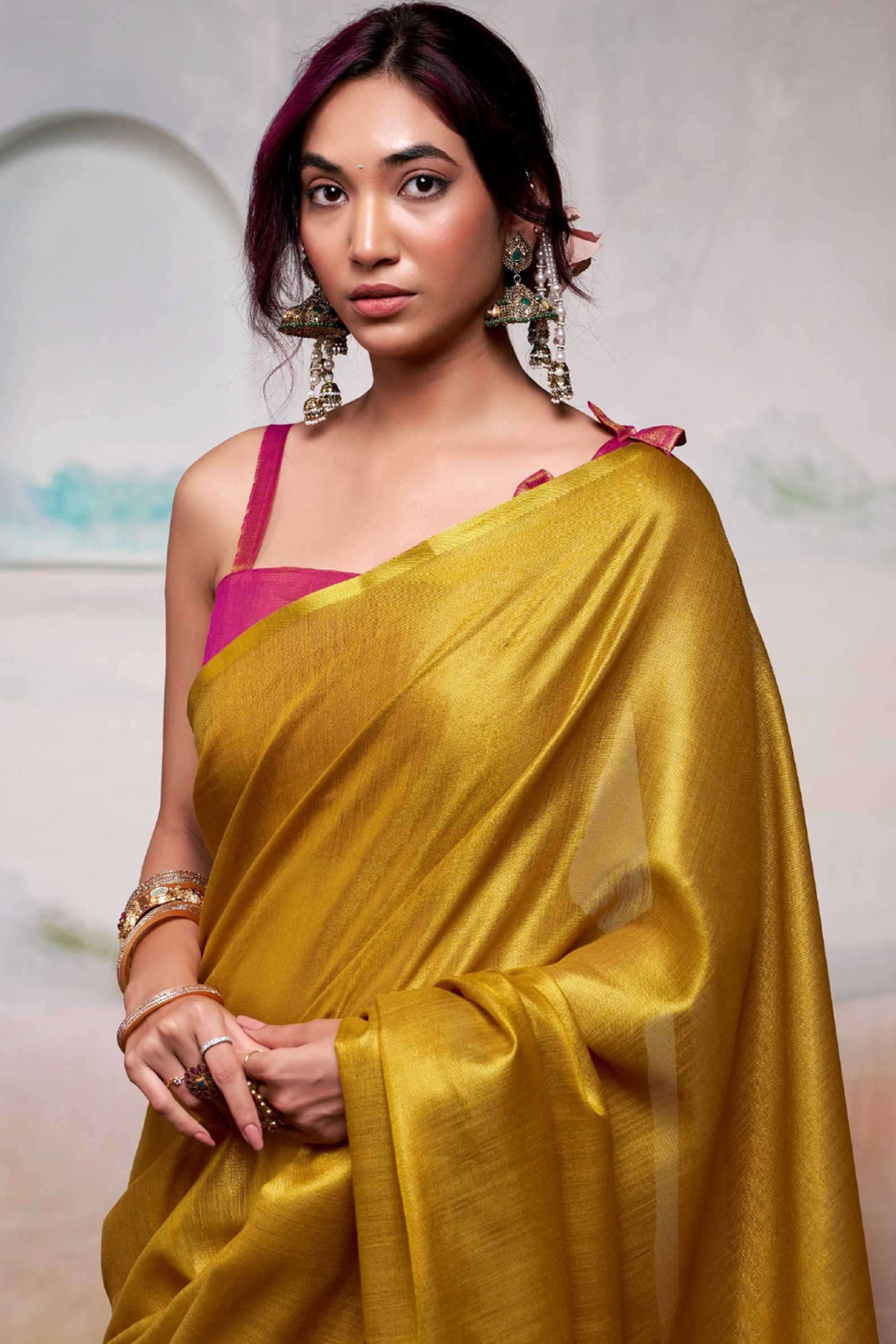 Graceful Mustard Tissue Silk Blend Saree Adorned with Intricate Zari Weaving & Tassel Pallu