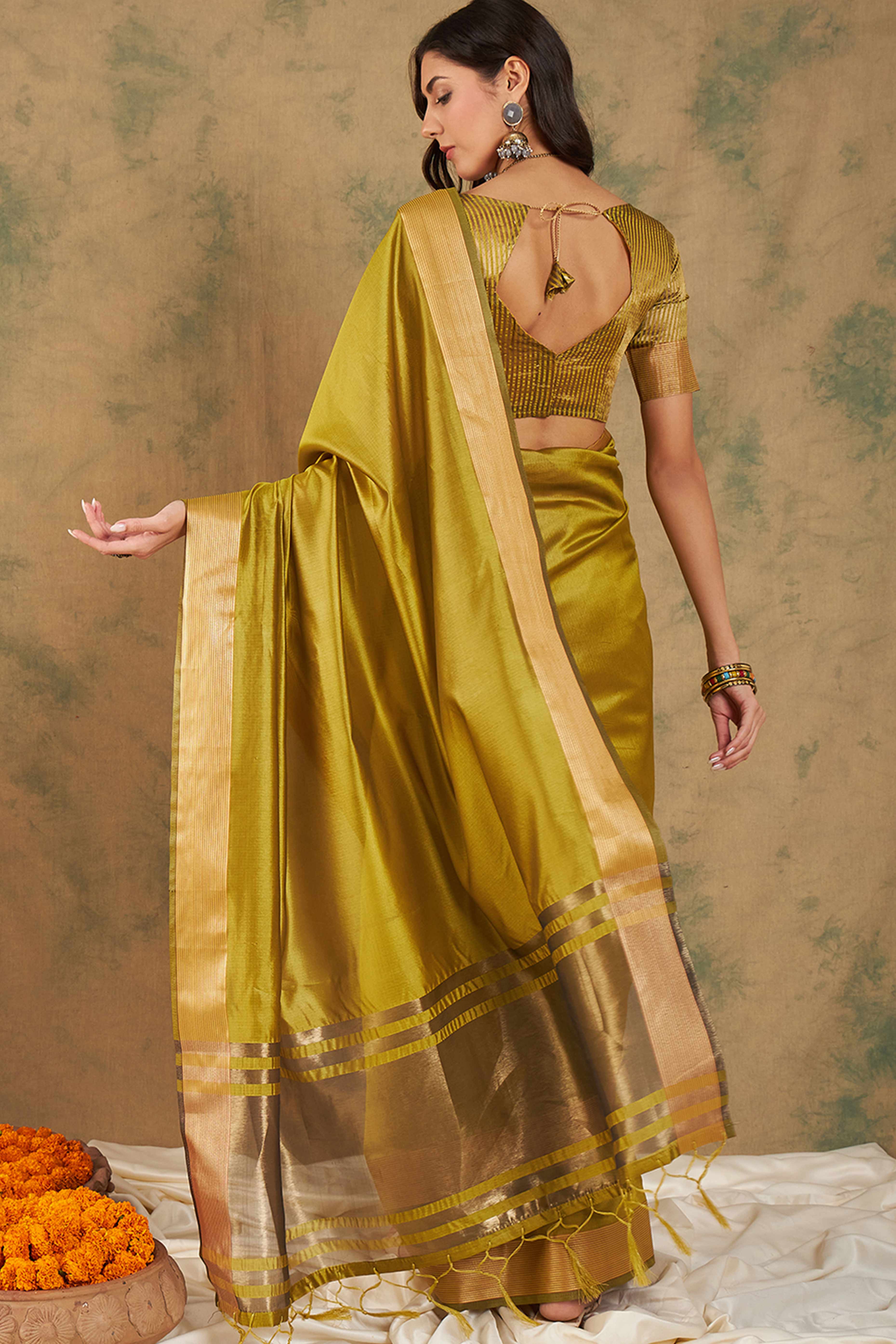 Olive Green Organza Saree In Organza With Delicate Weaving Border And Tassel Details