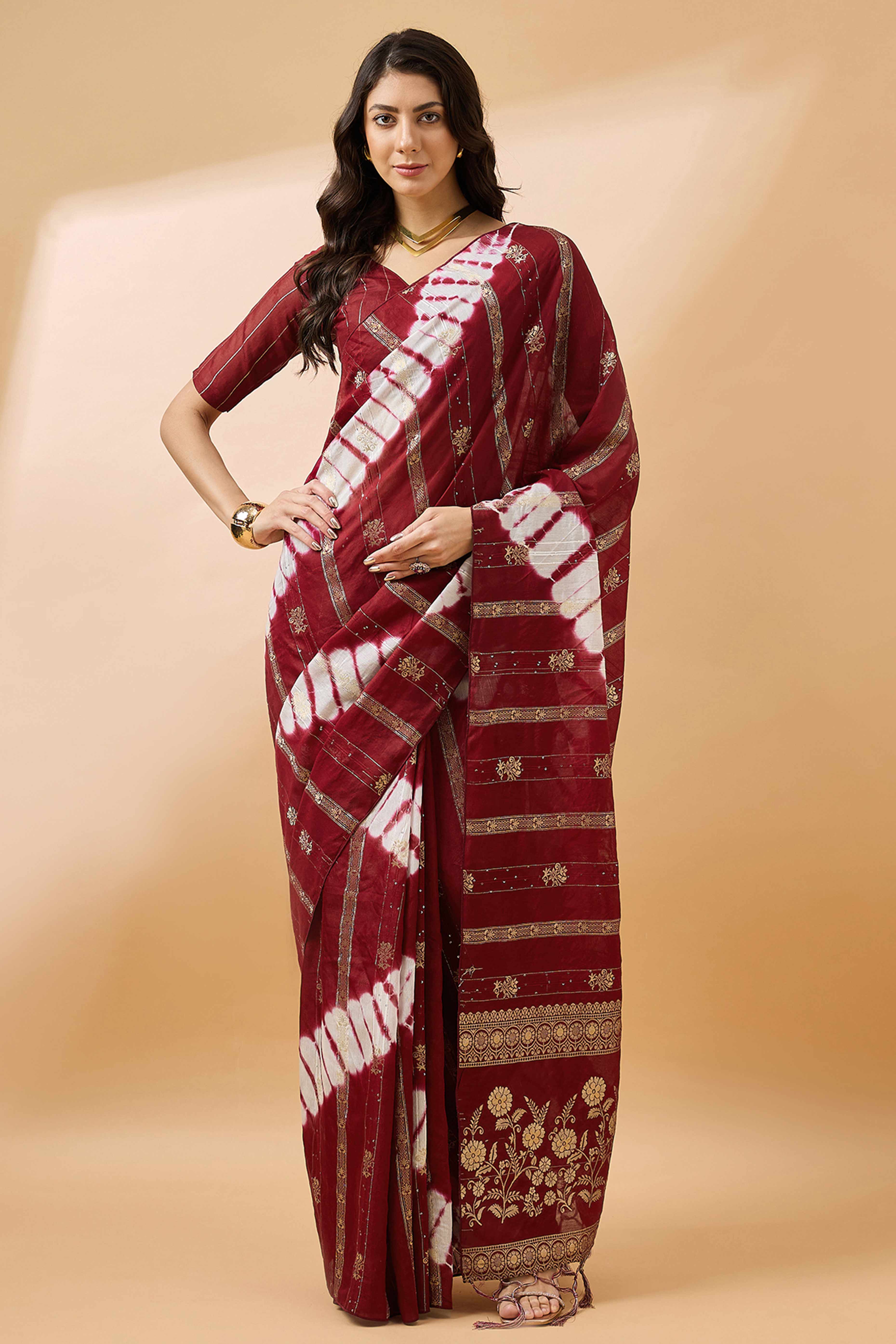 Maroon Floral Woven Staple Cotton Blend Saree Highlighted With Sequins Embroidery & Tasselled Pallu