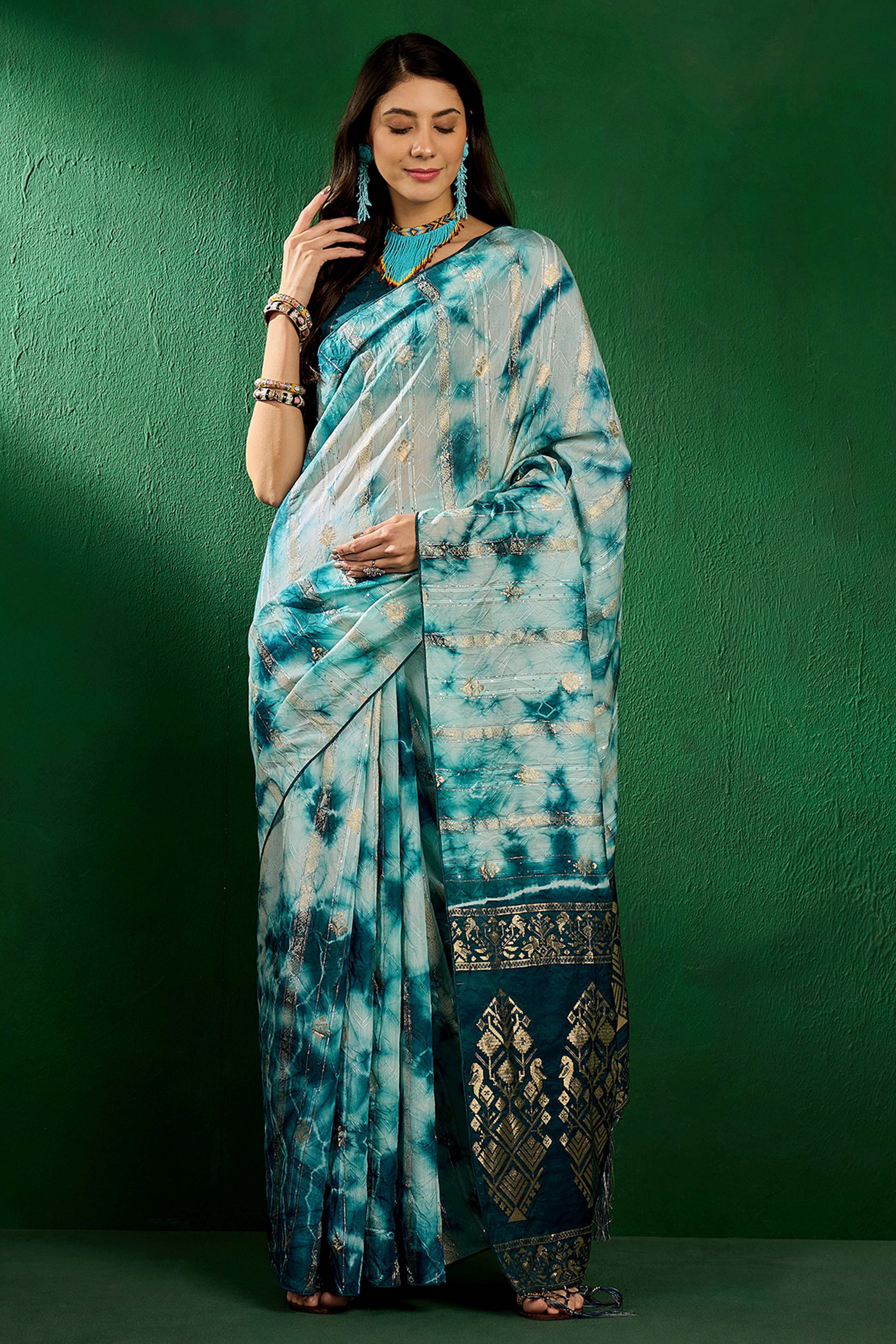 Floral Zari Woven Teal Saree In Cotton Blend With Sparkling Sequins & Elegant Tassel Pallu