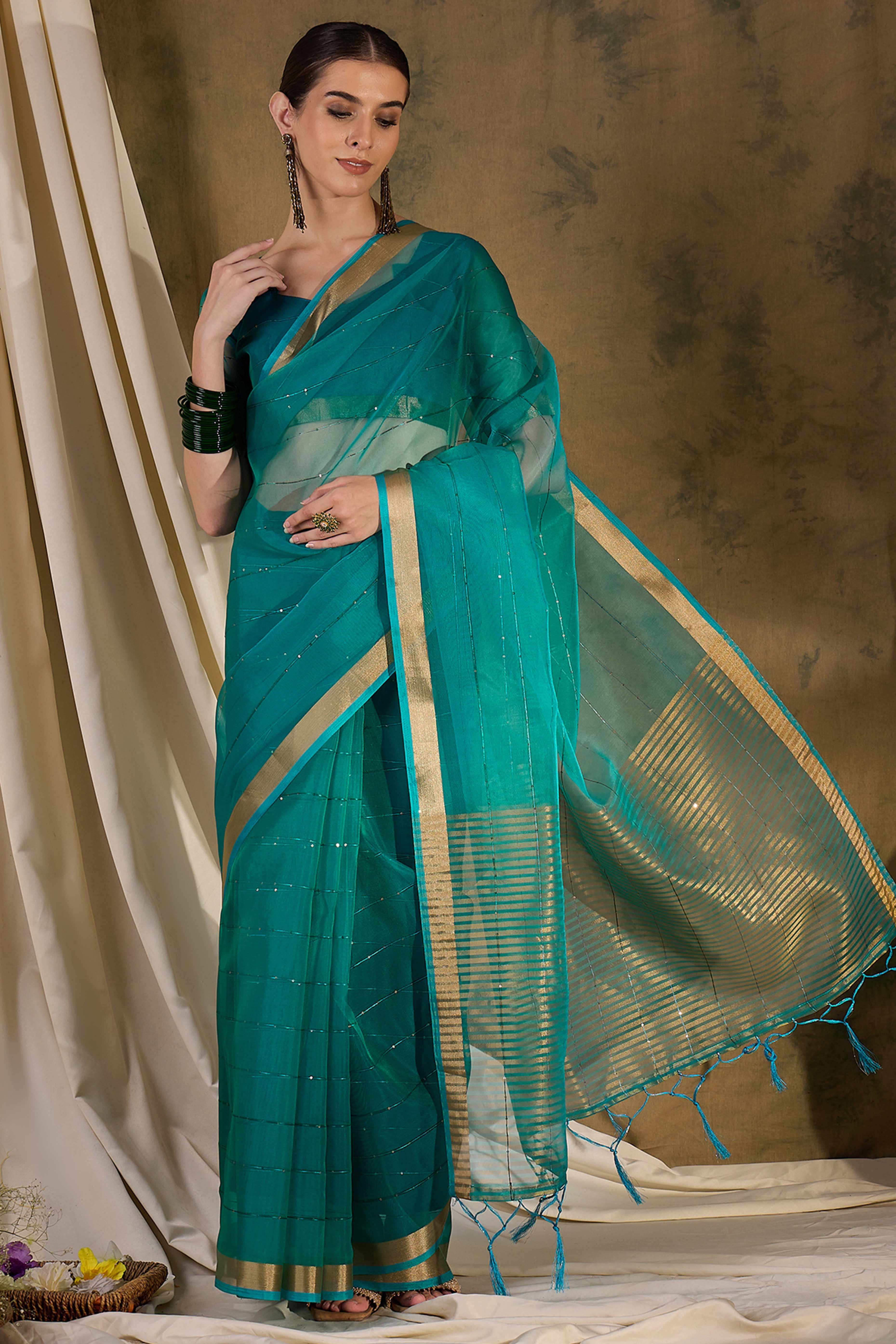 Teal Organza Silk Saree Featuring Shimmering Sequins Embroidery & Elegant Tasselled Pallu