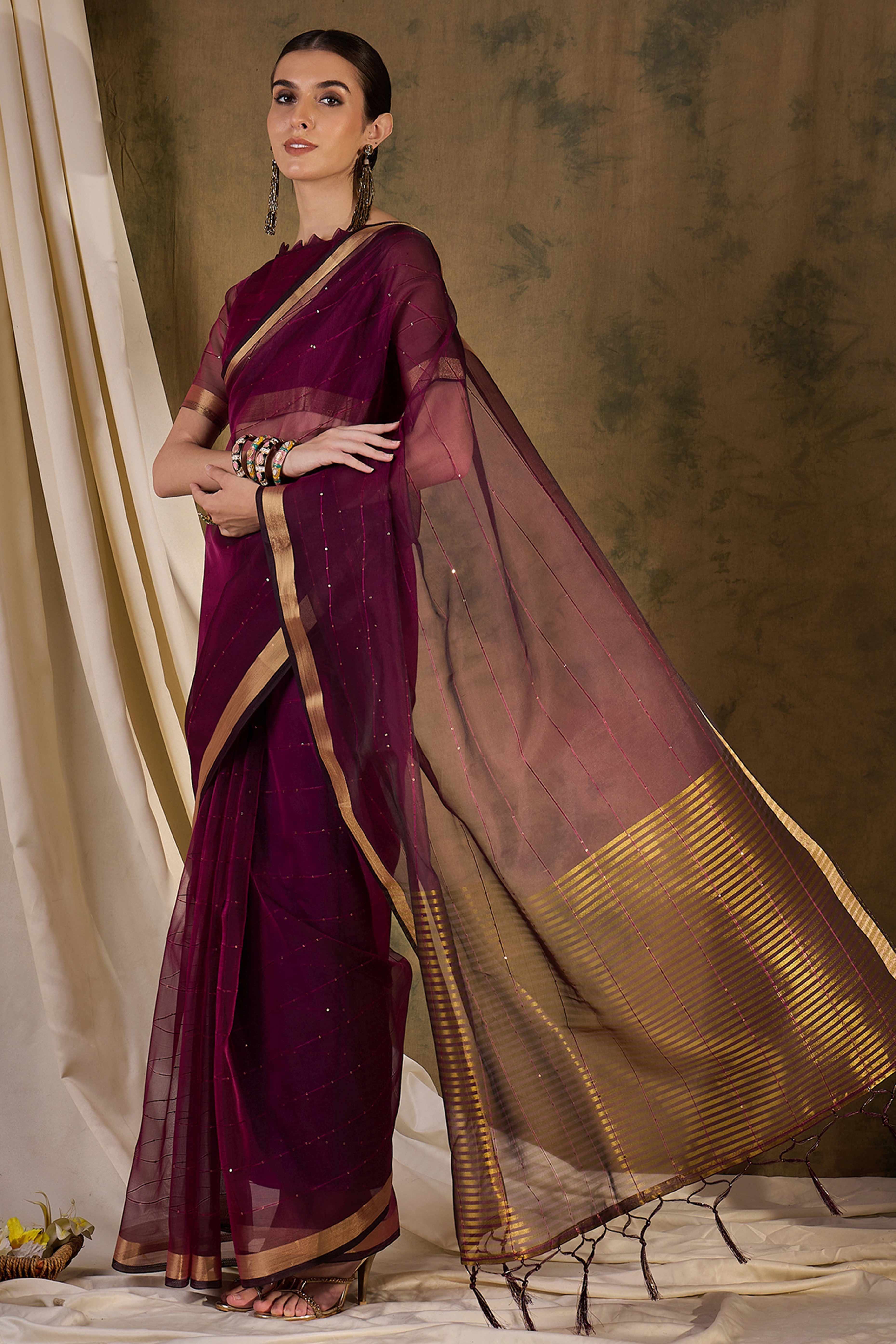 Wine Organza Silk Saree Featuring Shimmering Sequins Embroidery & Elegant Tasselled Pallu
