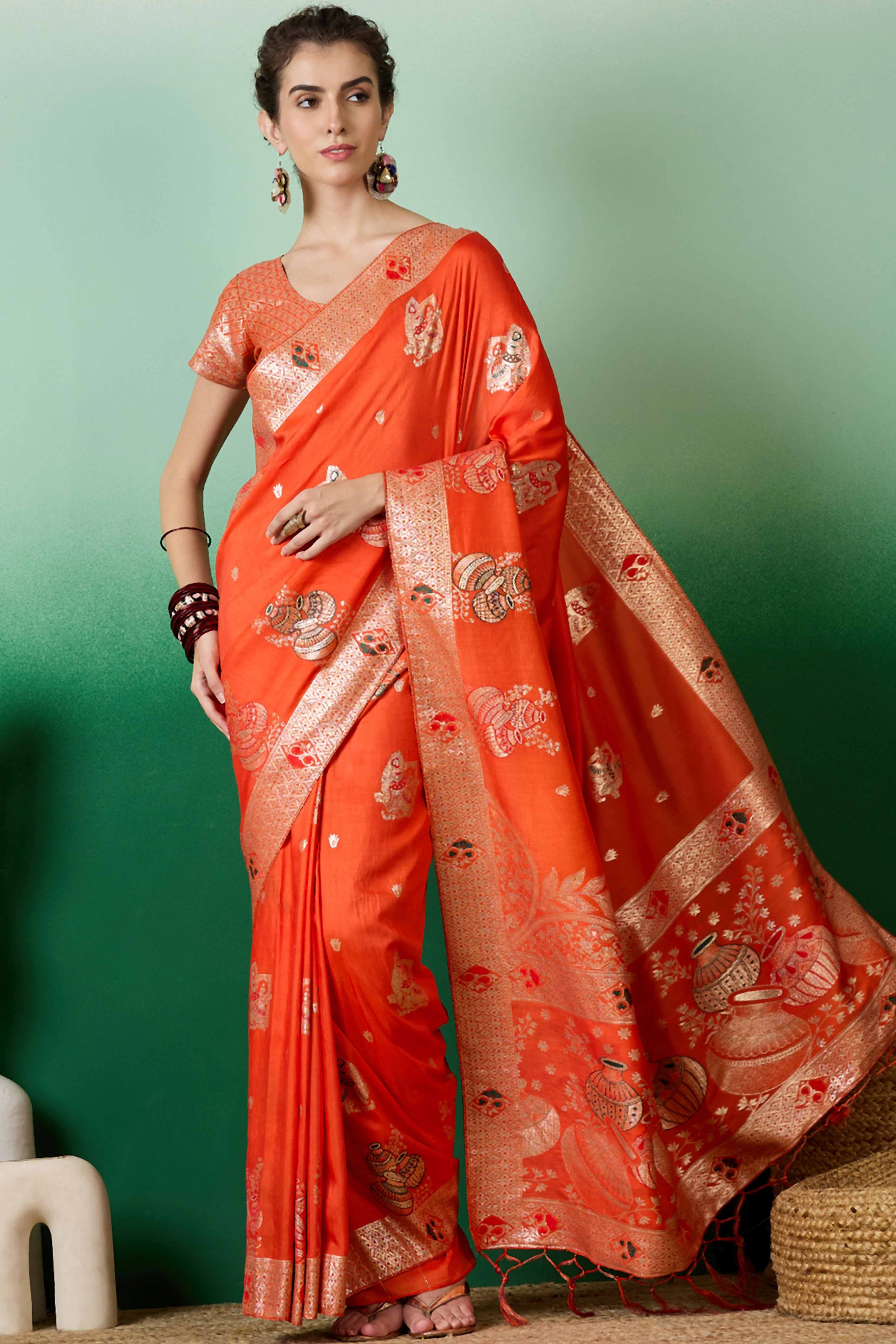 Orange Cotton Blend Saree Adorned With Floral Zari Weaving & Soft Tassel Accents
