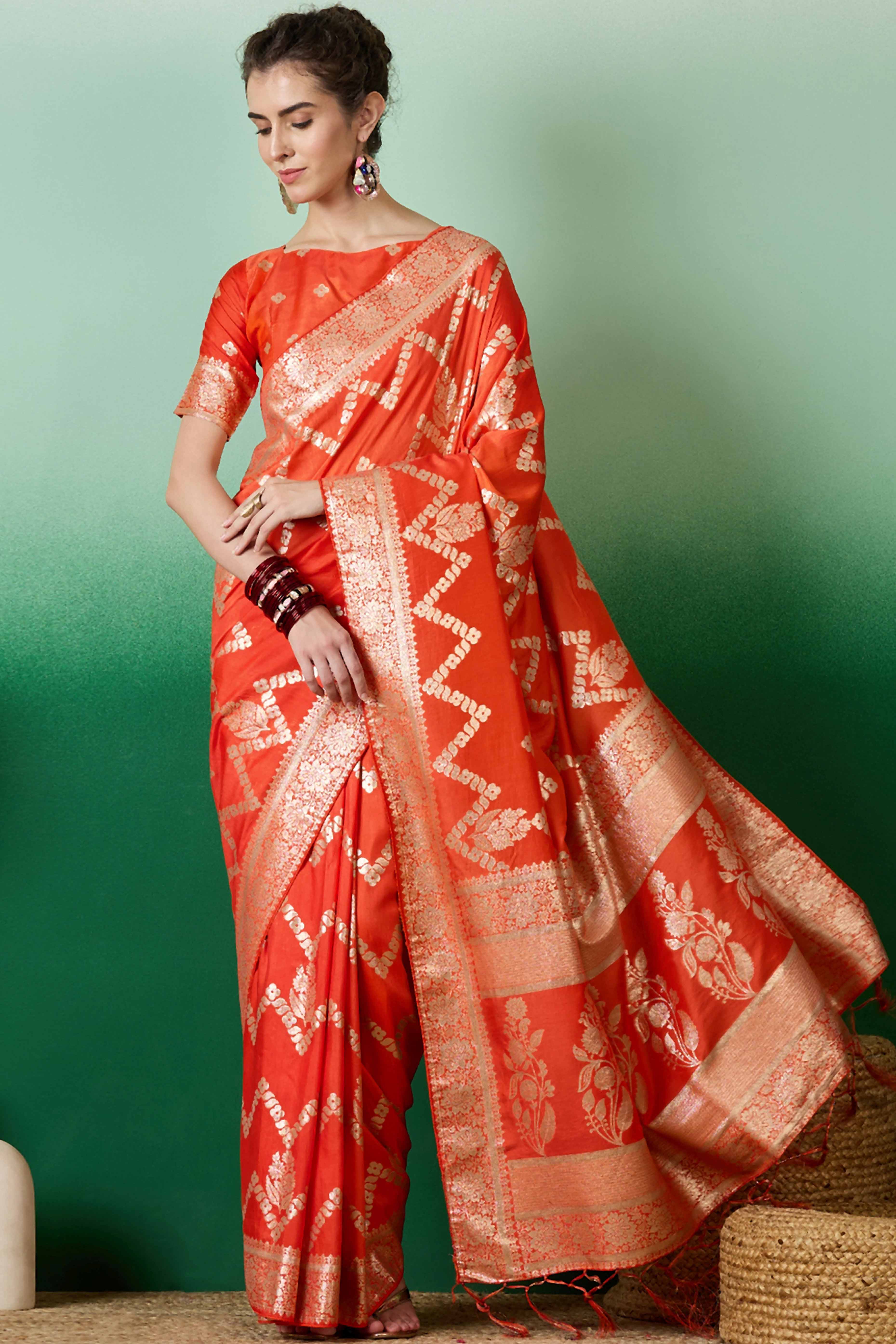 Orange Cotton Blend Jacquard Saree Adorned With Floral Weaving & Graceful Tassel Pallu