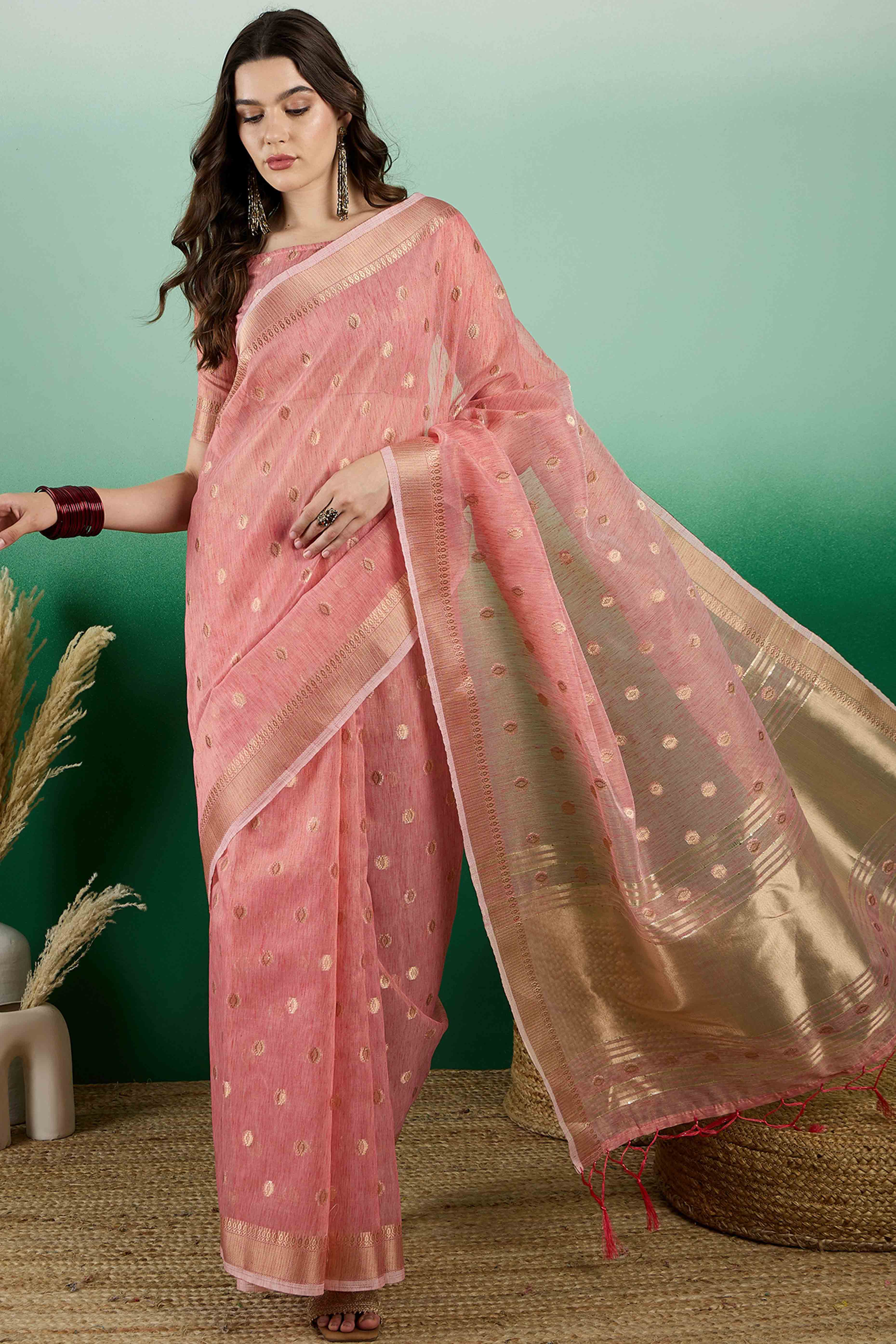 Peach Khadi Organza Saree Embellished With Traditional Zari Work & Tassels