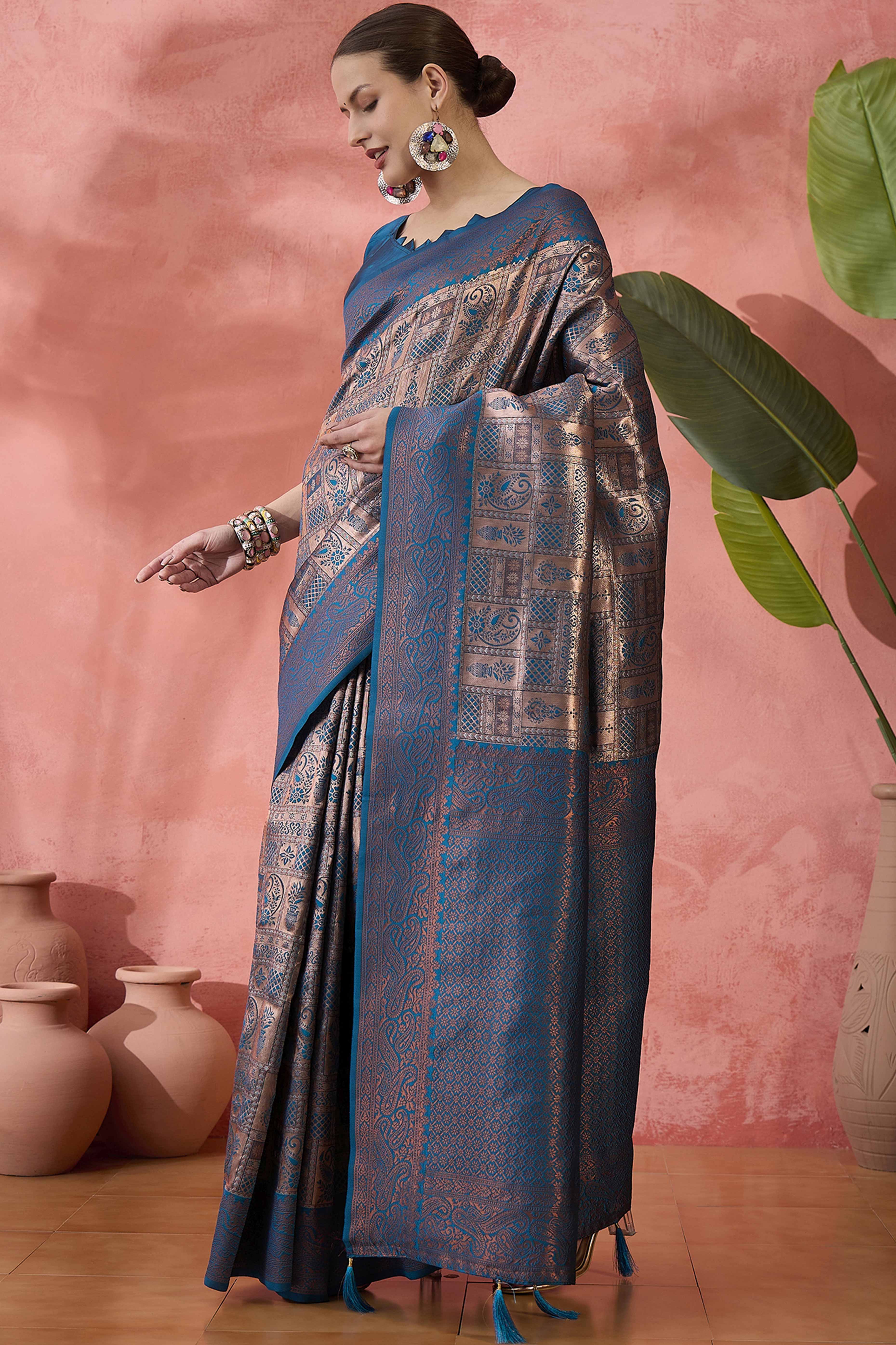 Blue Woven Poly Silk Blend Saree Featuring Floral & Paisley Motifs With Tassel Accents