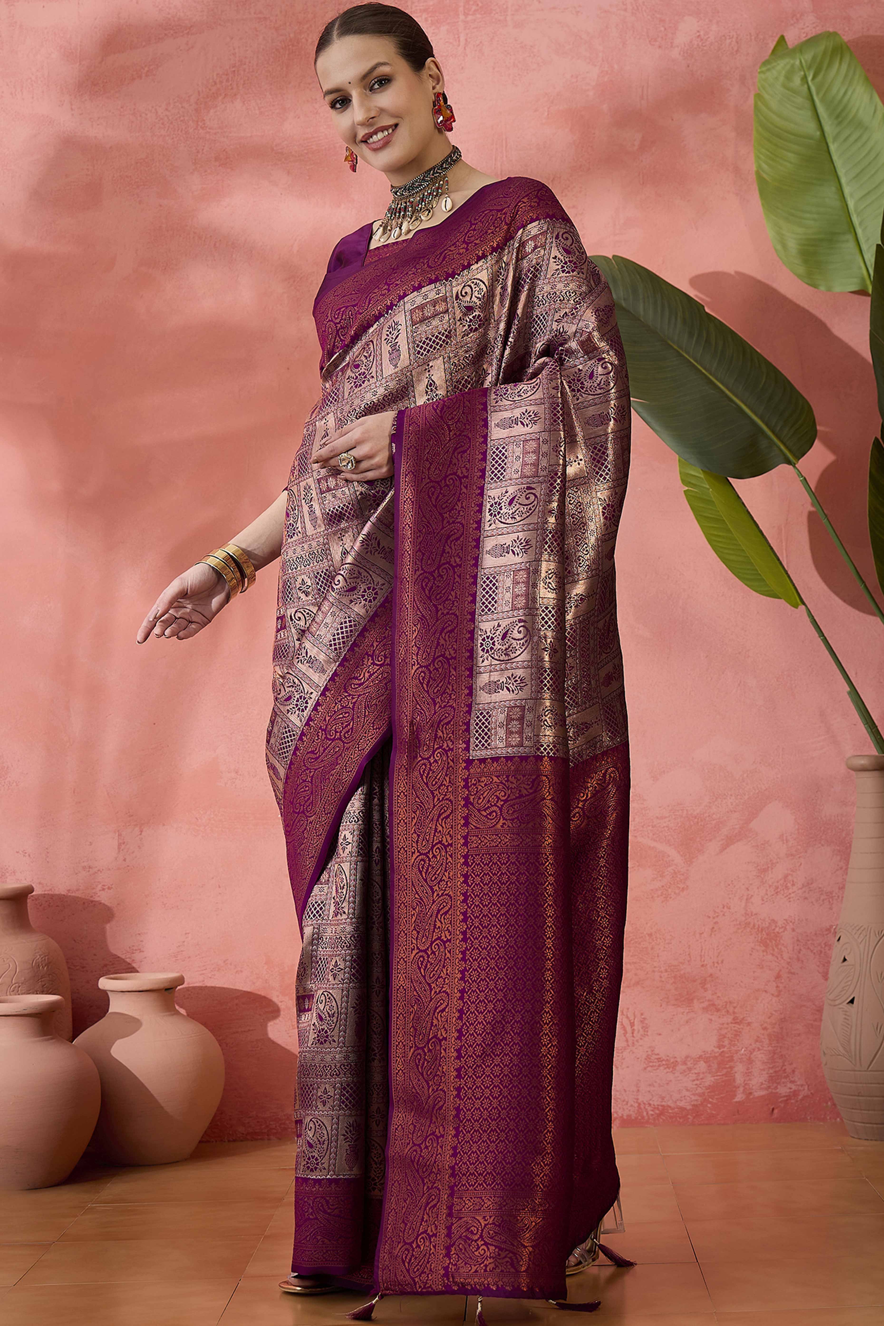 Wine Woven Poly Silk Blend Saree Featuring Floral & Paisley Motifs With Tassel Accents