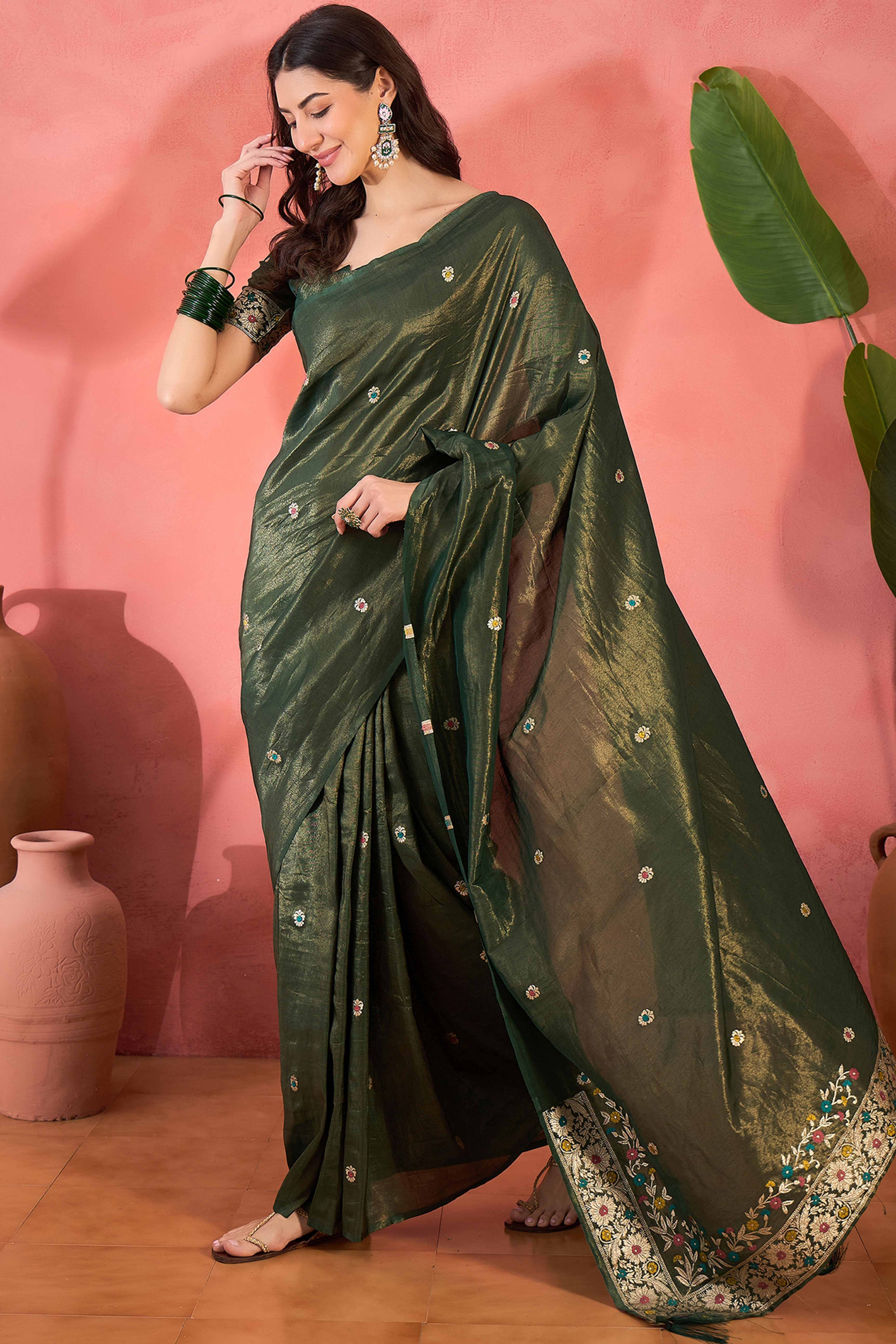Green Zari Woven Shimmer Saree With Floral Motifs & Flowing Tassel Pallu