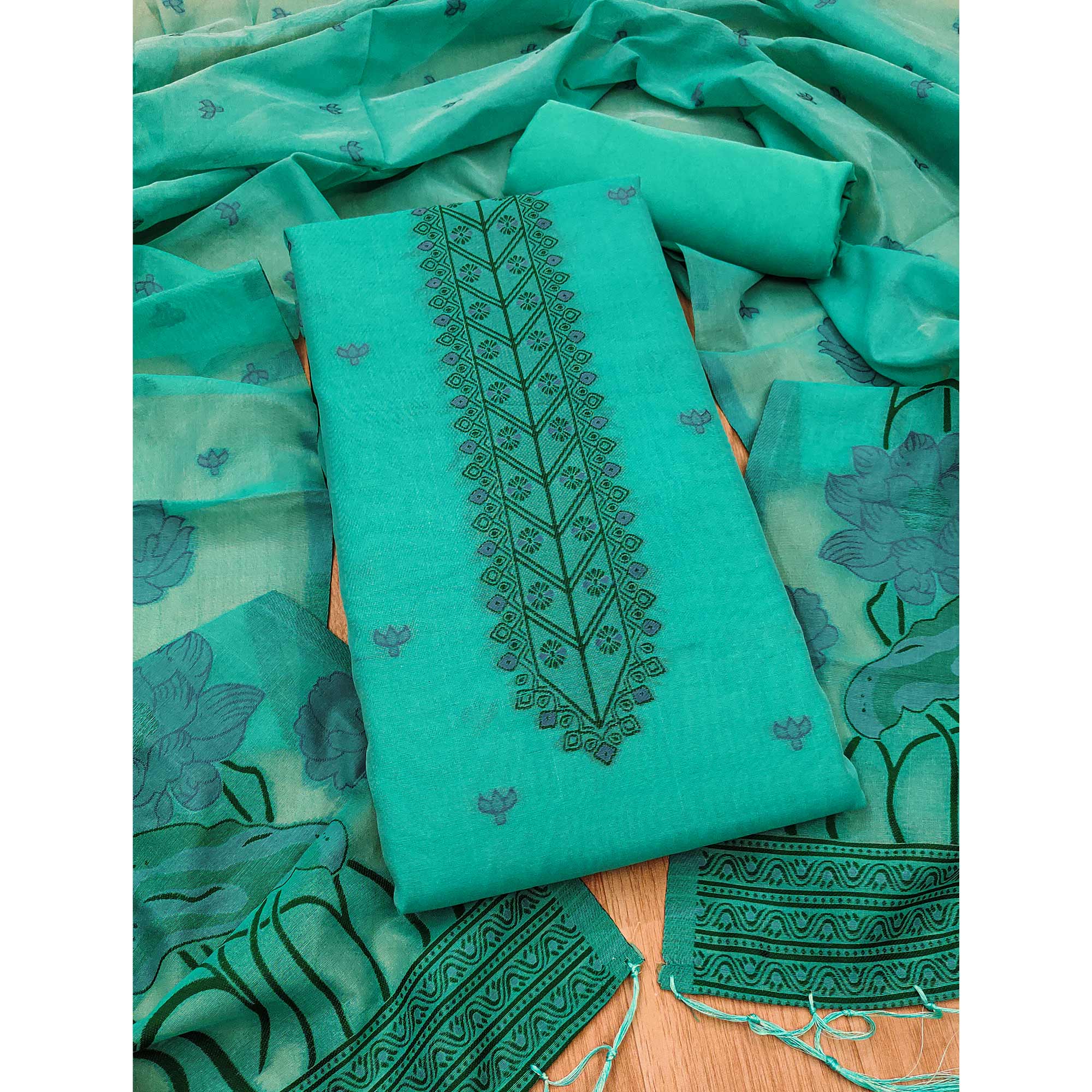 Sea Green Ethnic Dress Material Showcasing Handloom Style Floral Zari Weaving