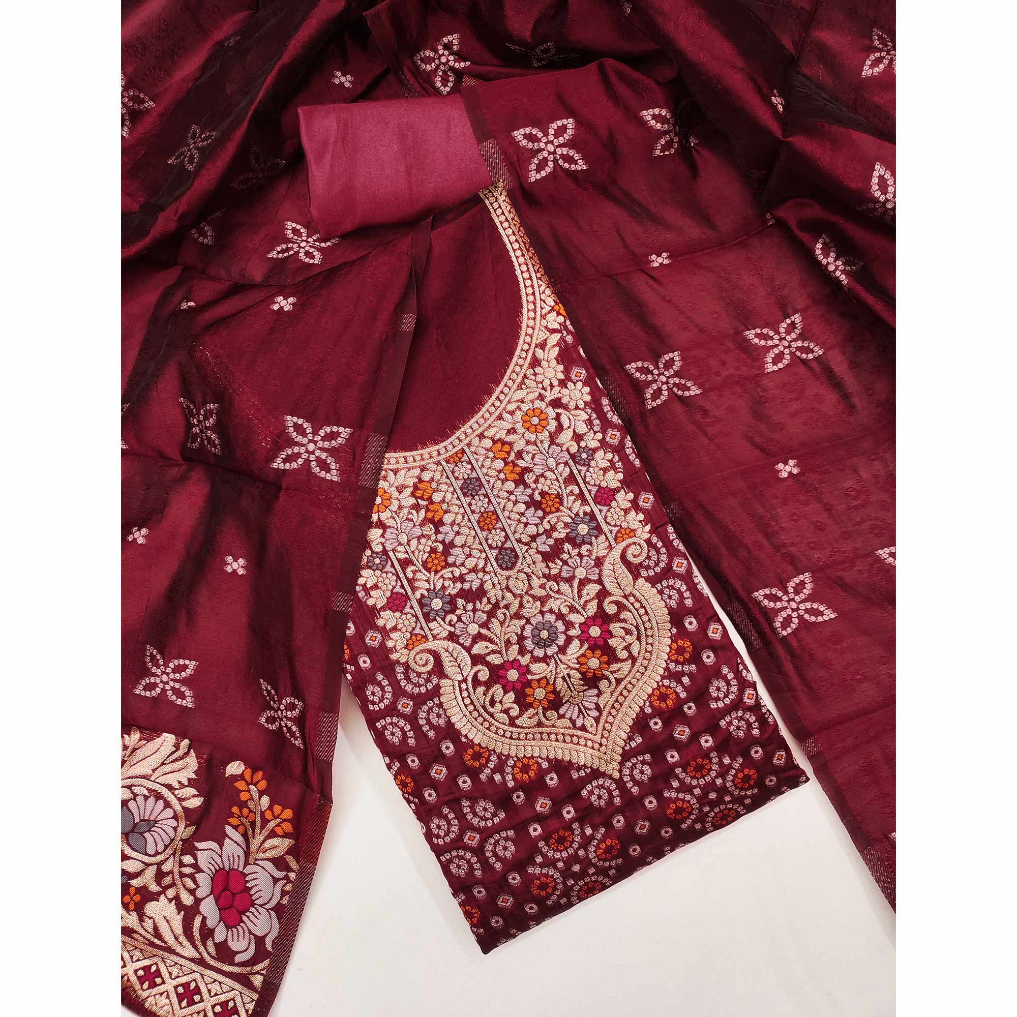 Maroon Banarasi Silk Jacquard Dress Material Adorned With Intricate Floral Zari Weaving