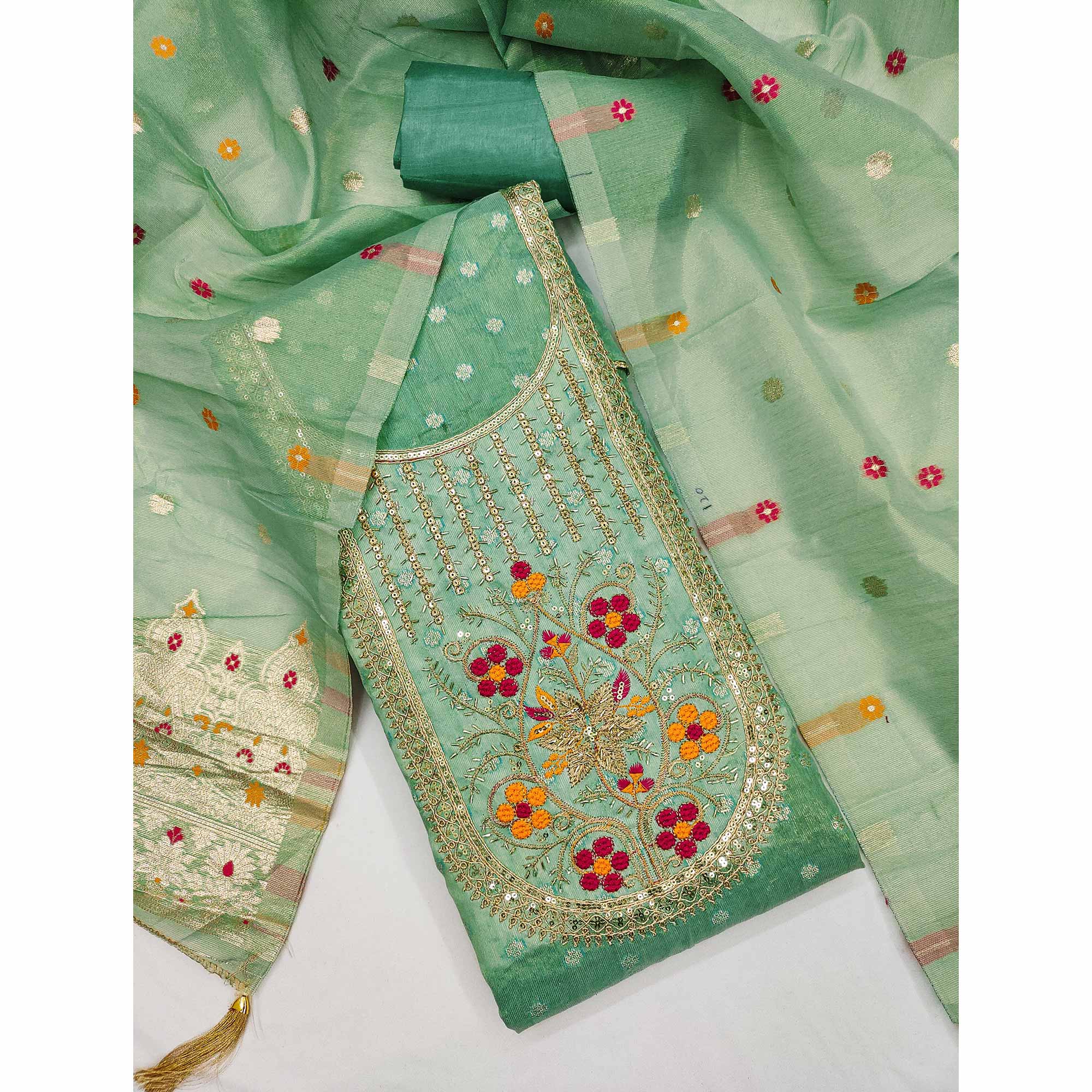 Green Shimmer Dress Material Adorned With Graceful Floral Weaving & Delicate Sequins Embroidery