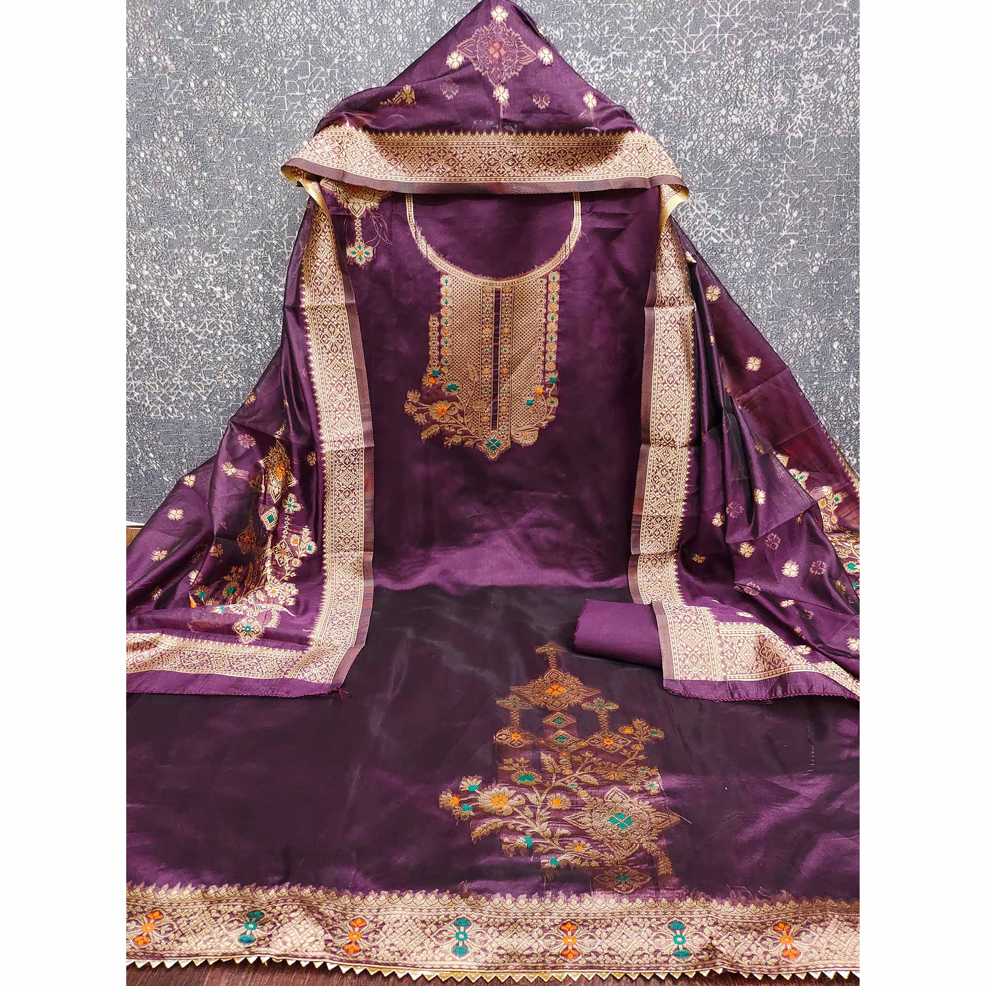 Wine Organza Silk Dress Material Adorned With Exquisite Floral Zari Weaving Work