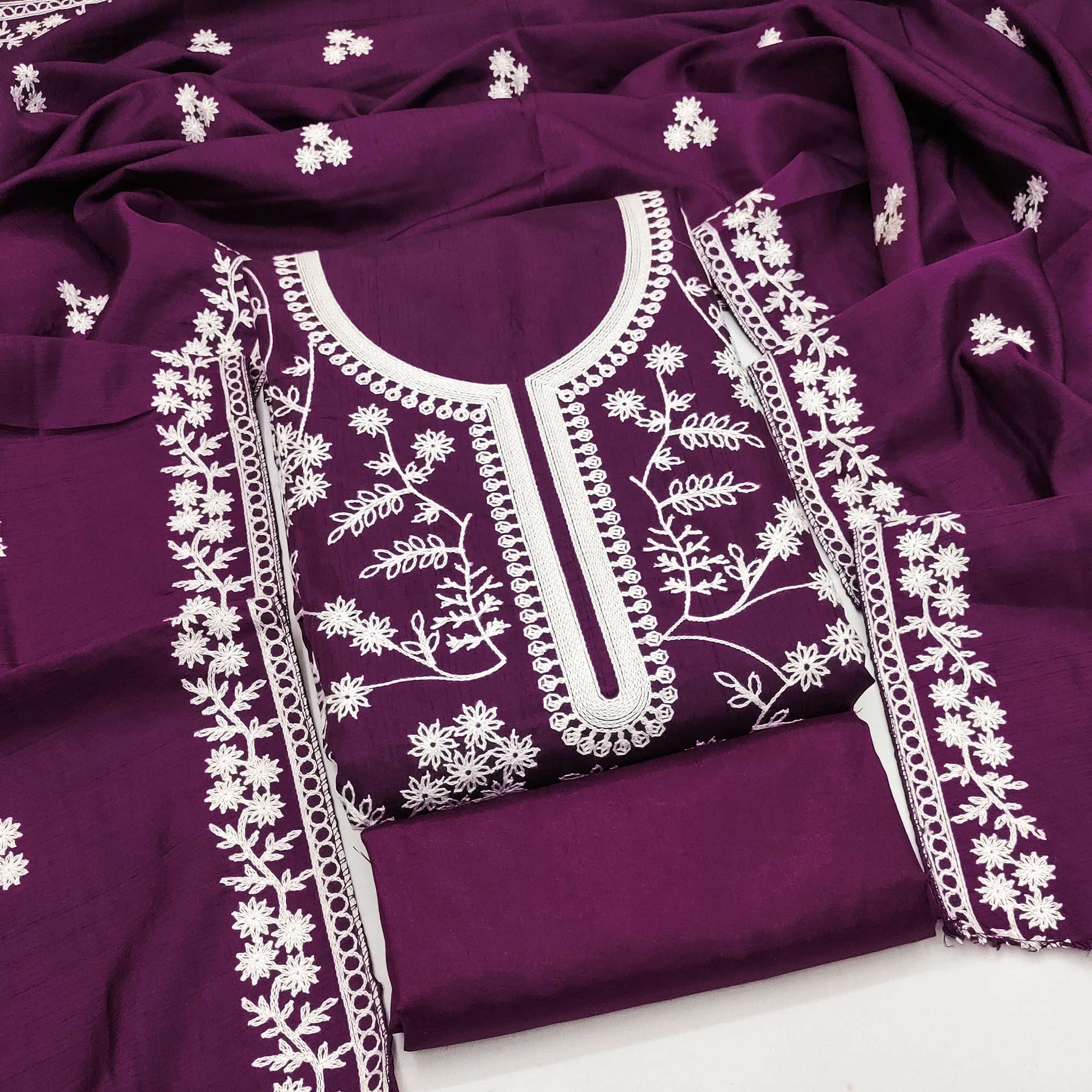 Purple Art Silk Dress Material Adorned With Floral Thread Embroidery Work