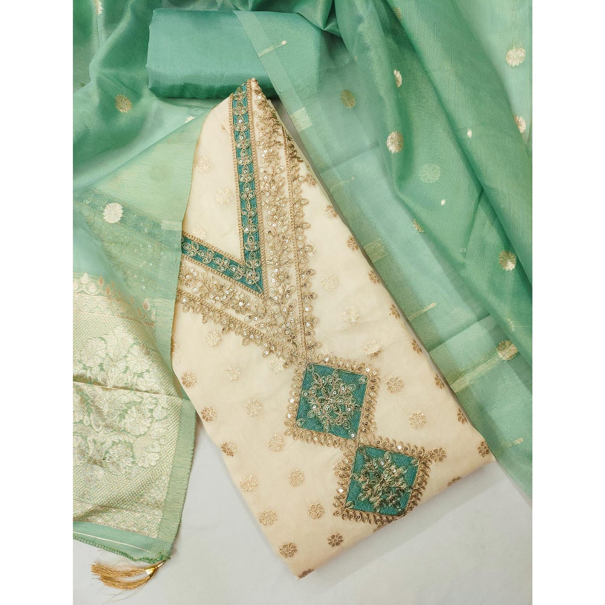 Cream & Green Shimmer Featuring Floral Butti Weaving With Cording Embroidered Dress Material
