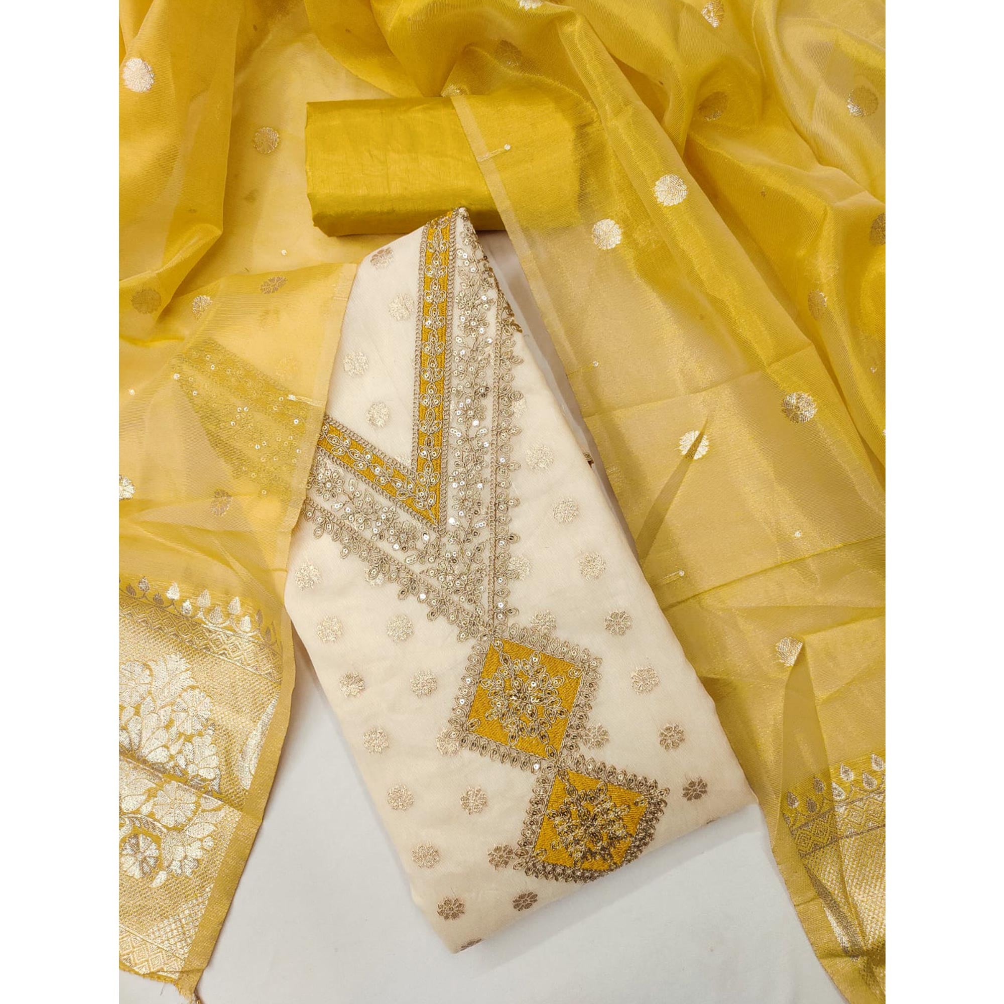 Cream & Yellow Shimmer Featuring Floral Butti Weaving With Cording Embroidered Dress Material