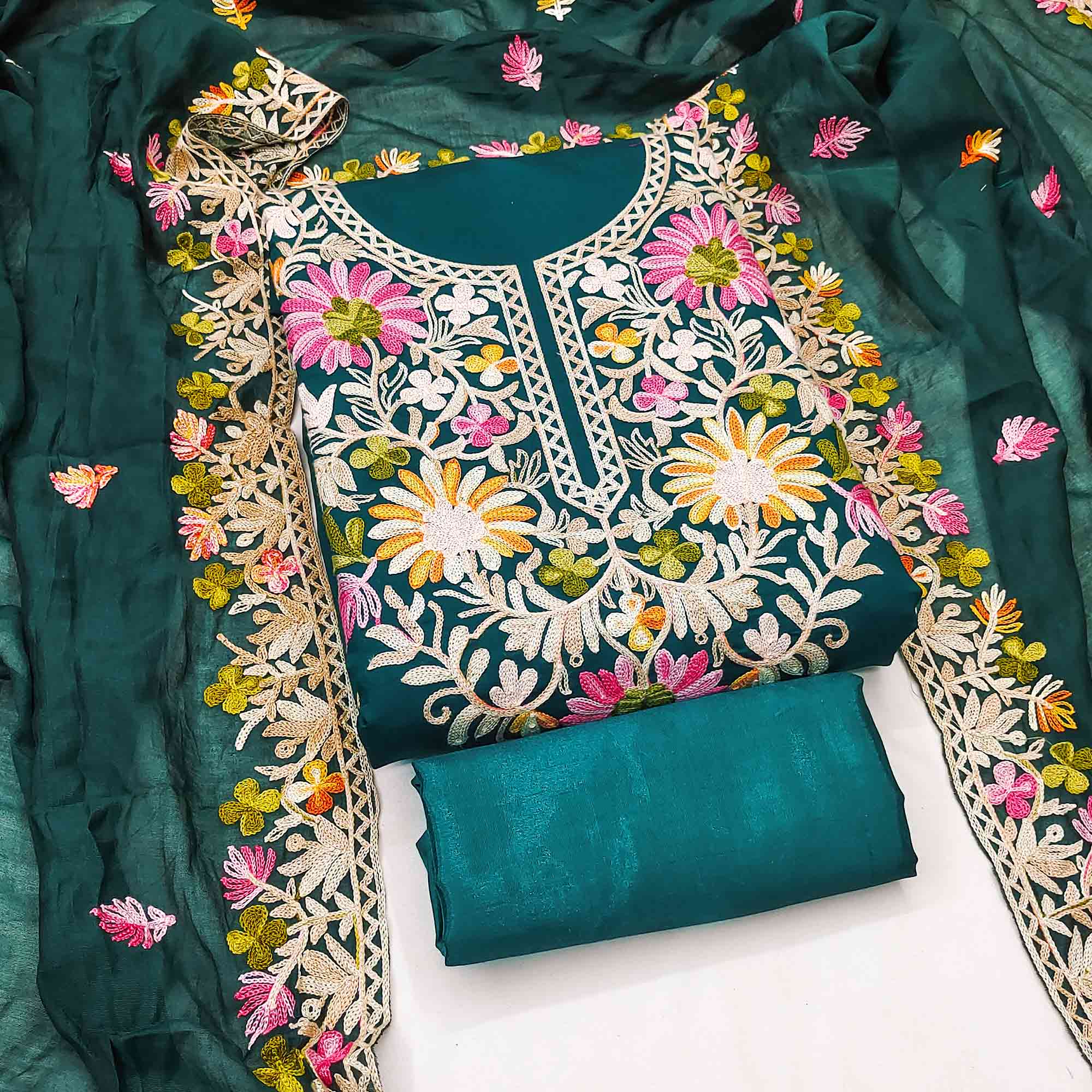 Teal Designer Roman Art Silk Dress Material Adorned With Floral Thread Embroidery Work