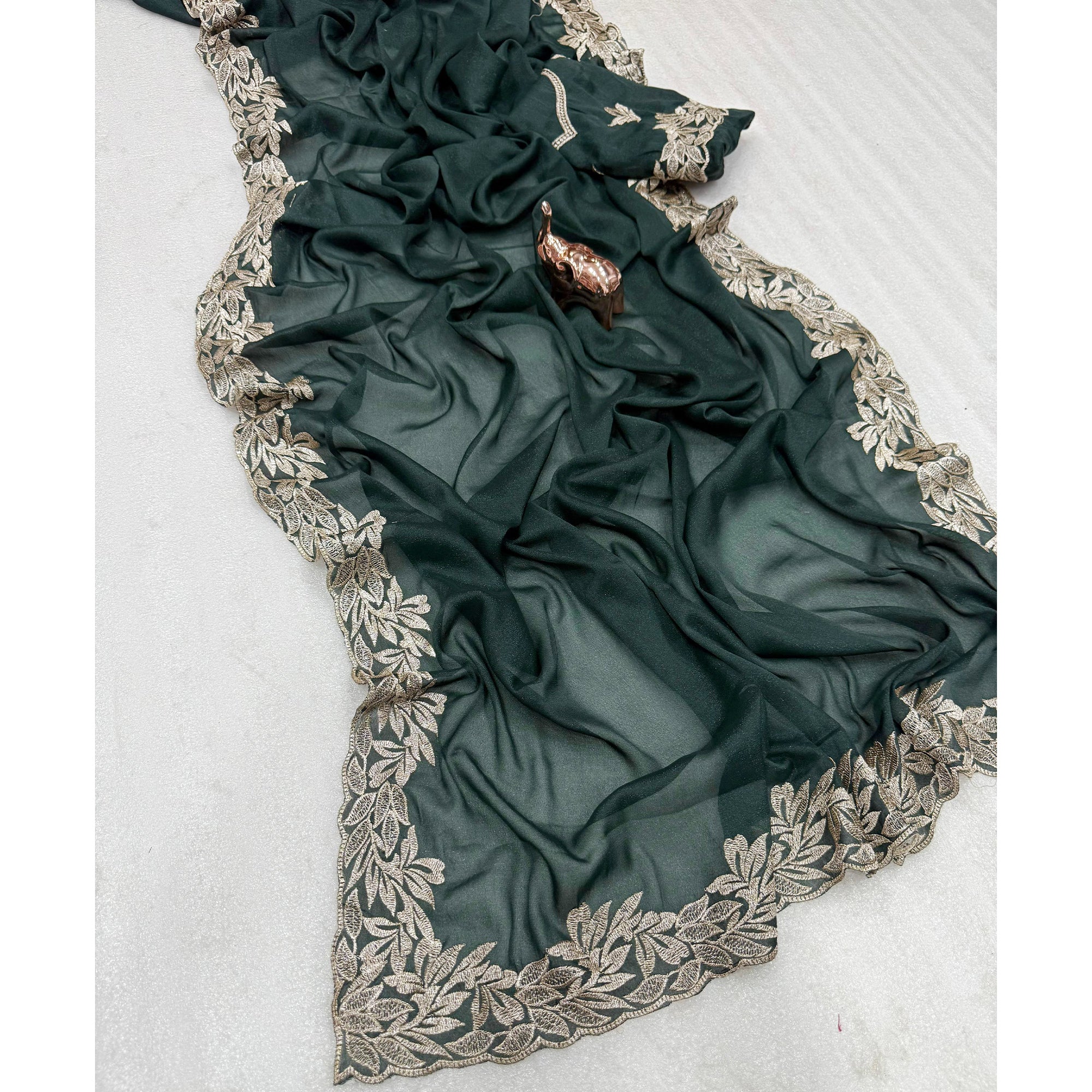 Stylish Dark Green Star Chiffon Saree with Traditional Zari Embellished Border