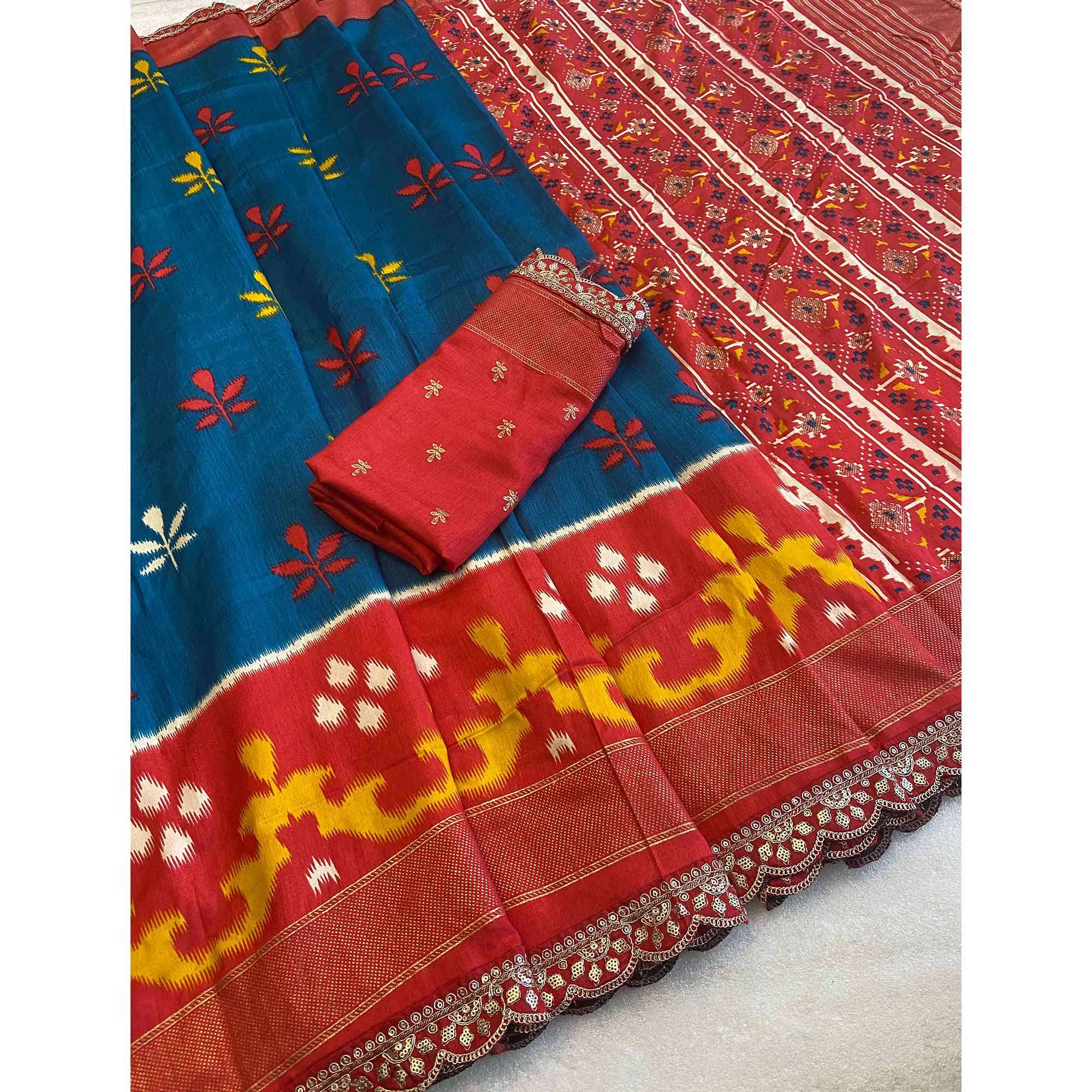 Teal Patola Printed Dola Silk Saree With Sequins Border