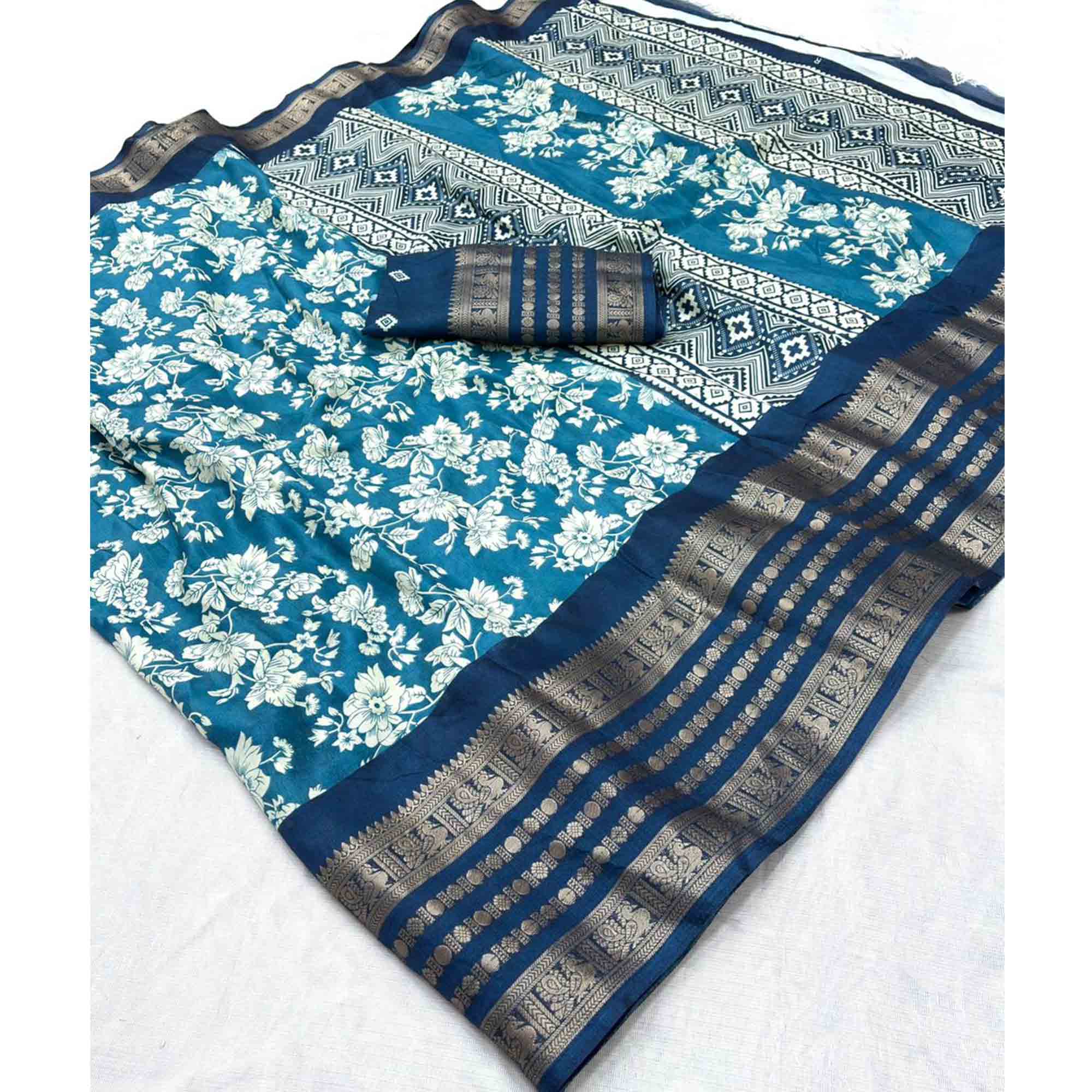 Luxurious Teal Blue Floral Print Dola Silk Saree With Intricate Peacock Motif Zari Woven Border