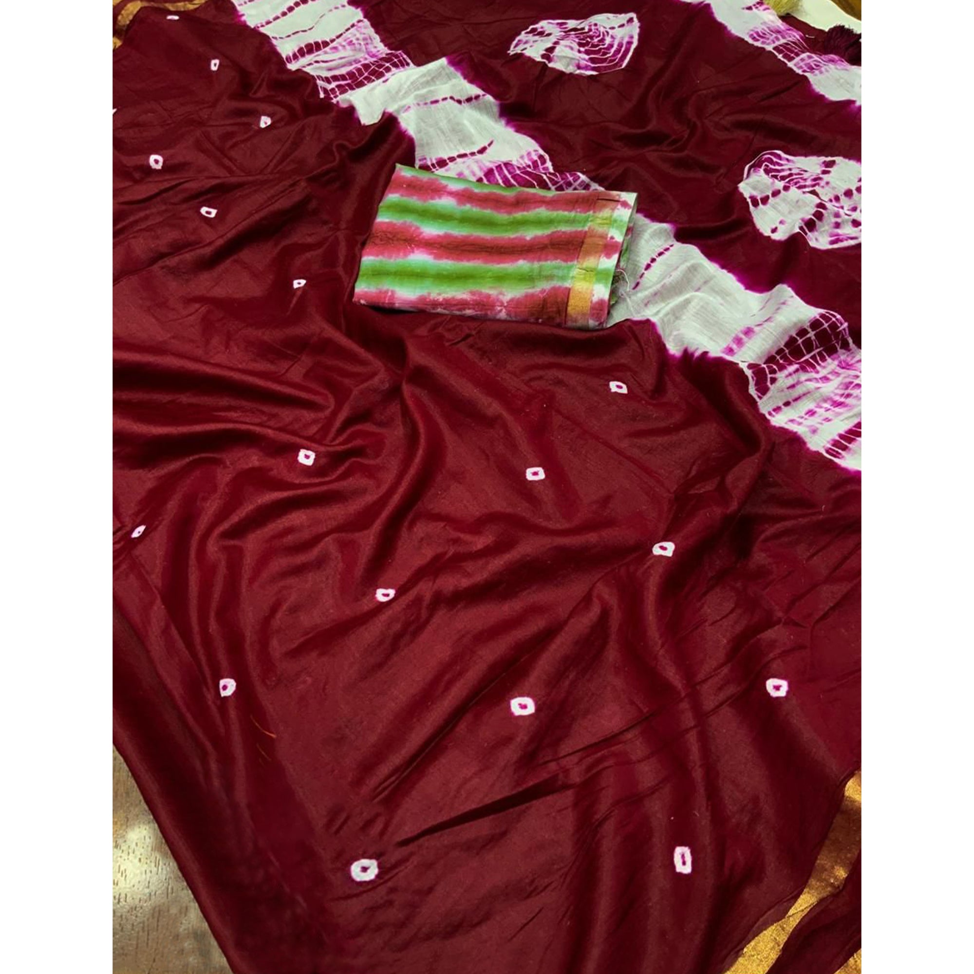 Maroon Linen Cotton Saree Adorned with Vibrant Bandhani Prints and Breezy Texture