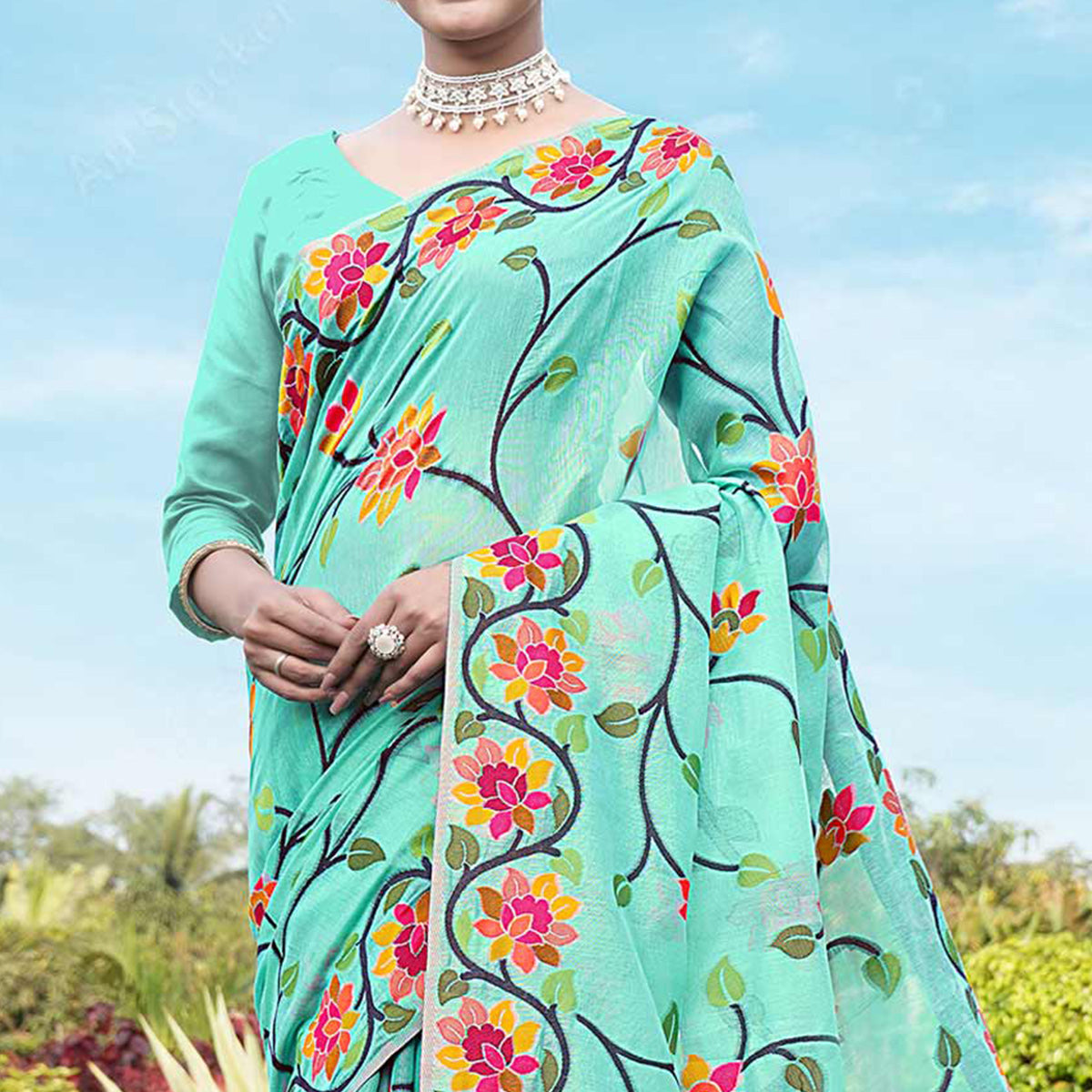 Turquoise Floral Woven Cotton Silk Saree With Tassels