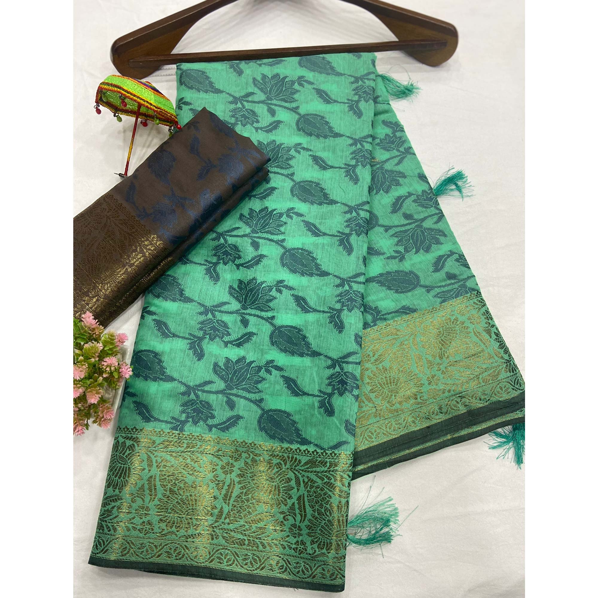 Turquoise Floral Woven Cotton Silk Saree With Tassels