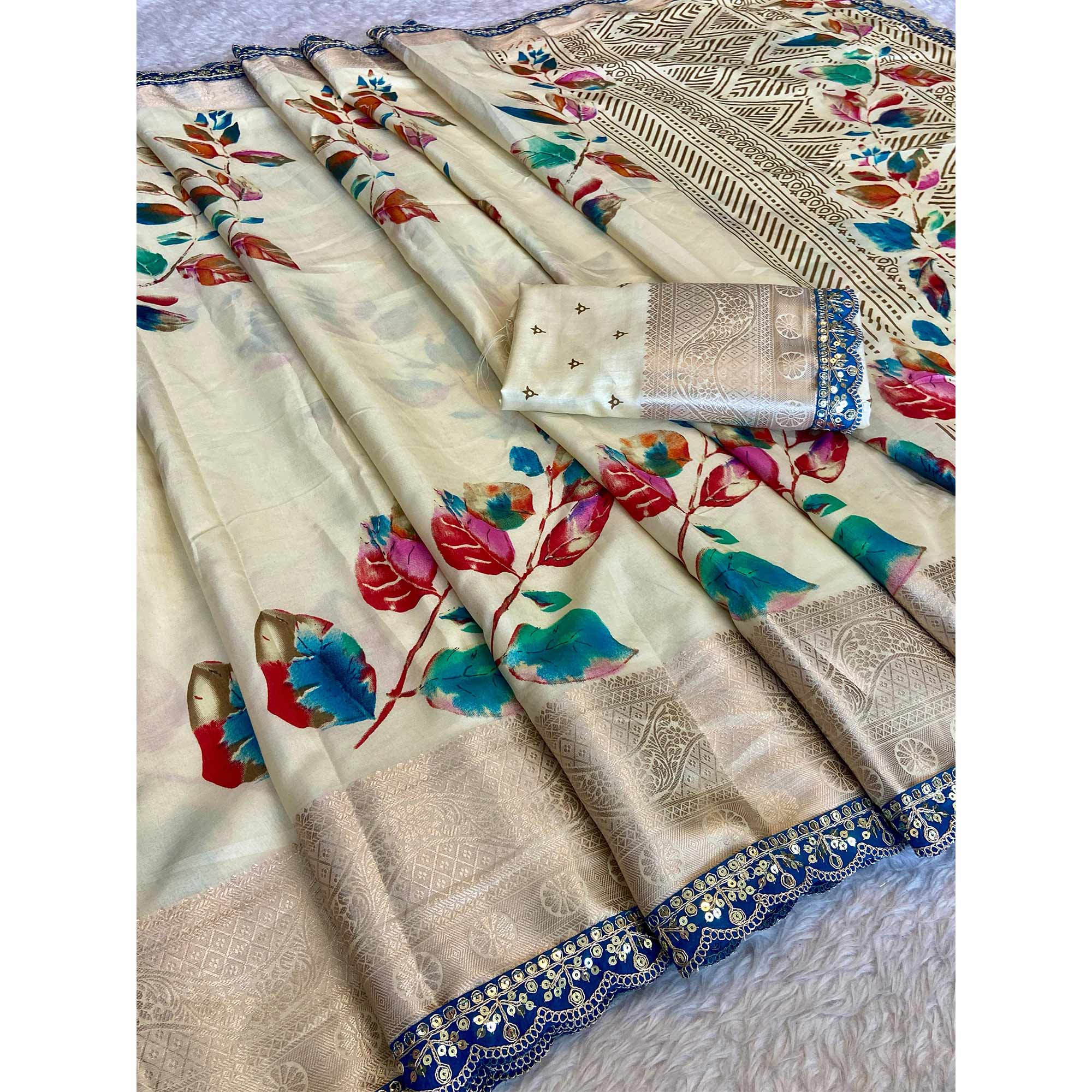 Cream Floral Printed Dola Silk Saree Accentuated with a Traditional Woven Border