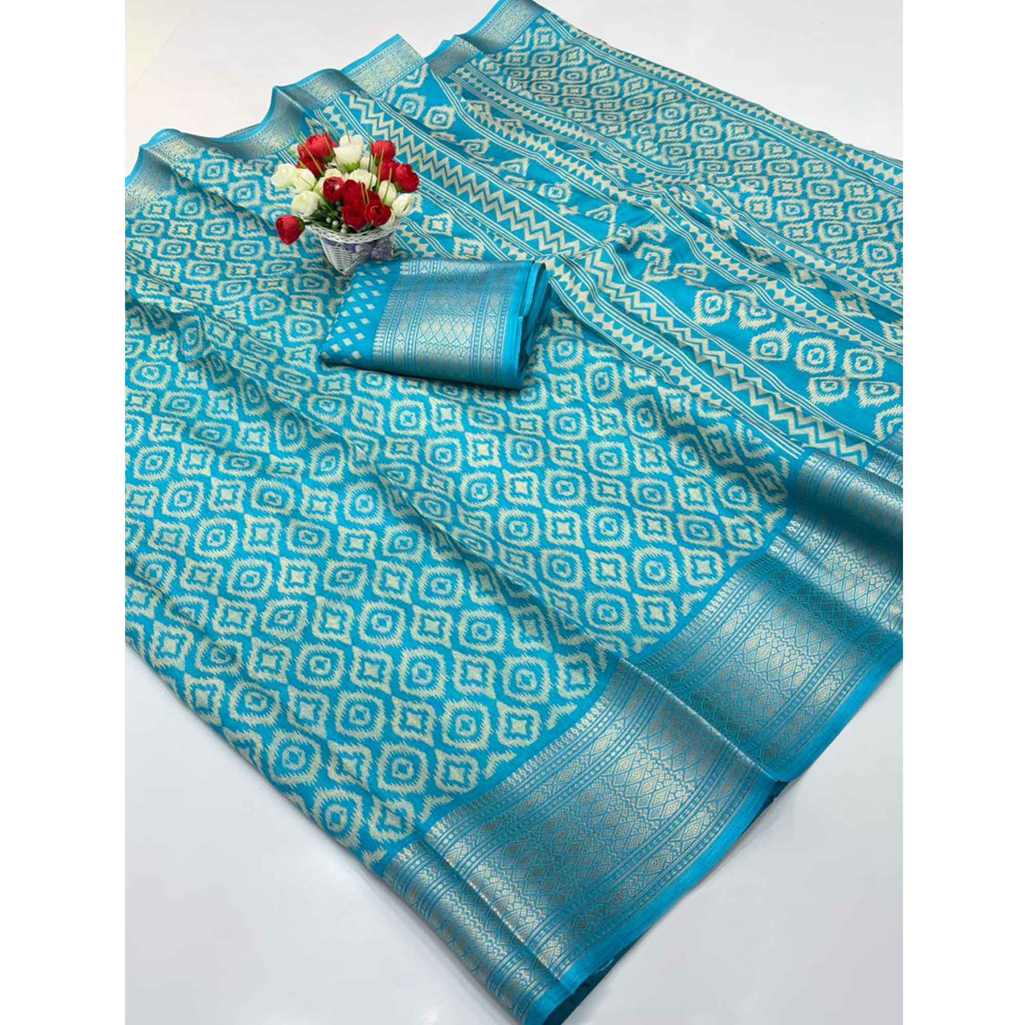 Blue Ikkat Printed Dola Silk Saree Highlighted With Premium Zari Weaving Border