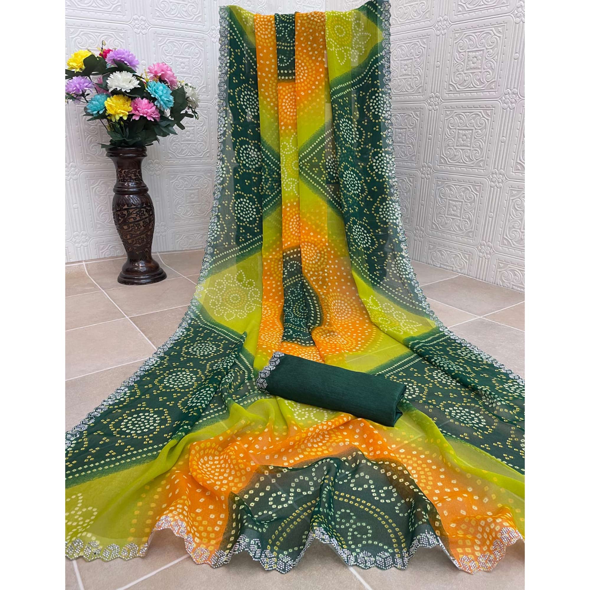 Green & Orange Georgette Saree With Traditional Bandhani Print And Sparkling Stone Work Border
