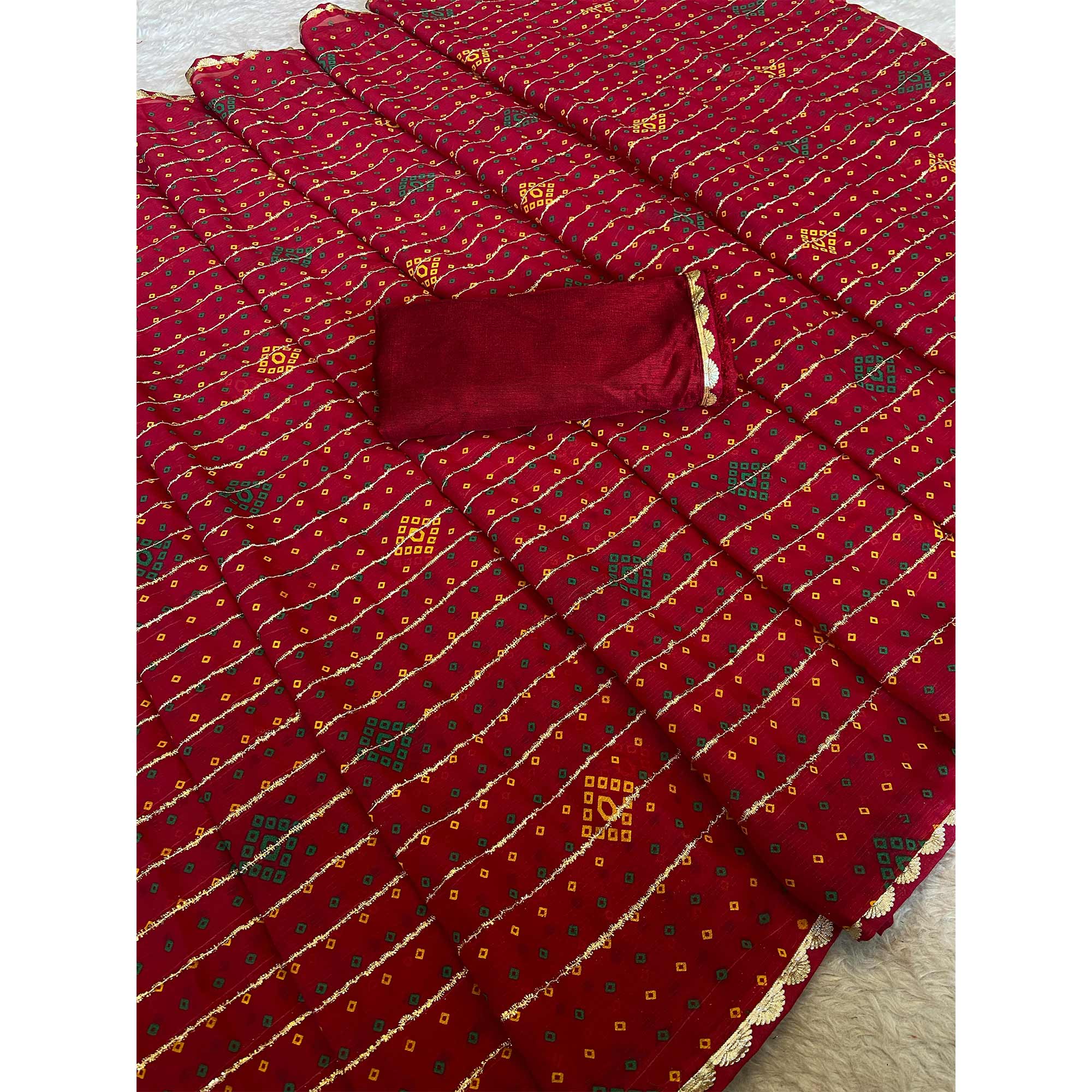Pink Bandhani Printed Chiffon Saree with Graceful Touches of Zari Work