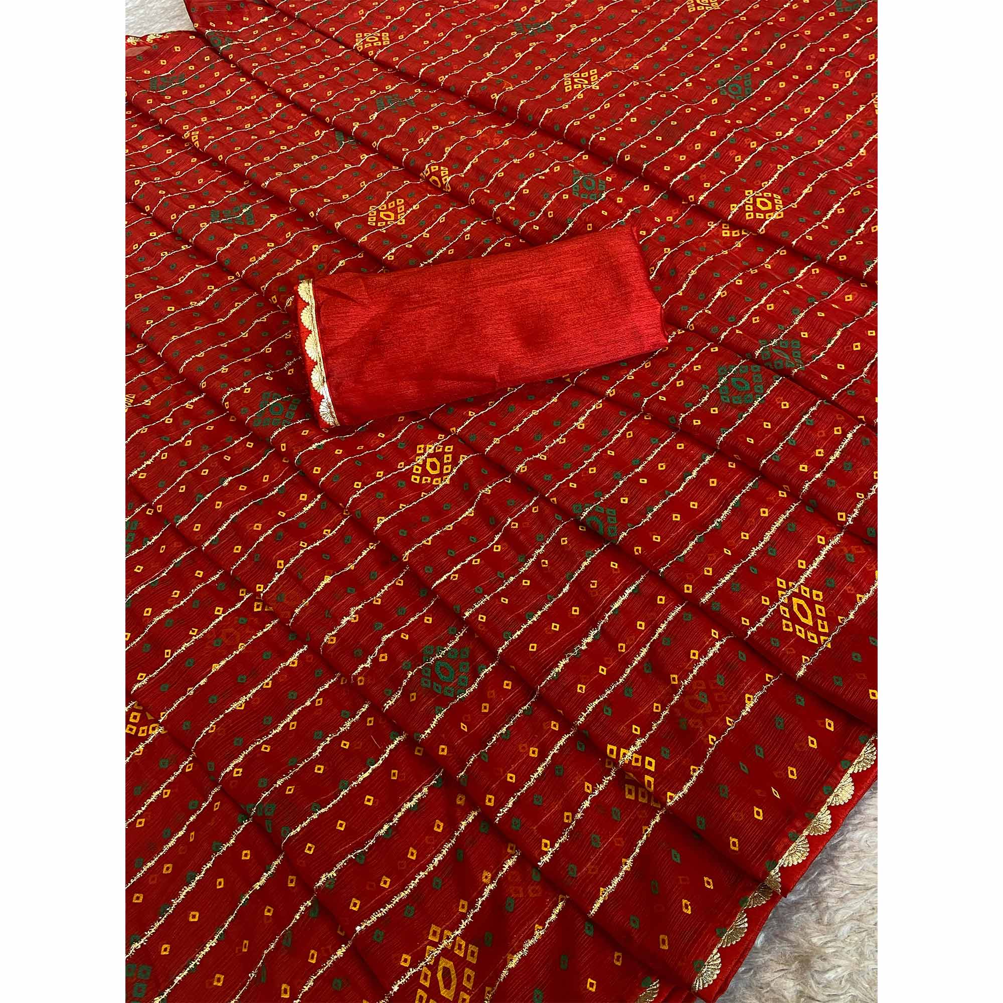 Red Bandhani Printed Chiffon Saree with Graceful Touches of Zari Work