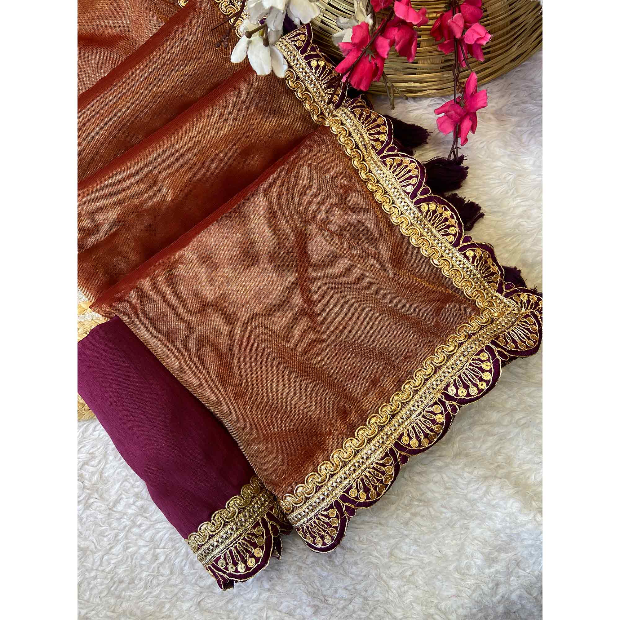 Orange Net Saree With Intricate Sequin Embroidery & Tassel Embellished Pallu