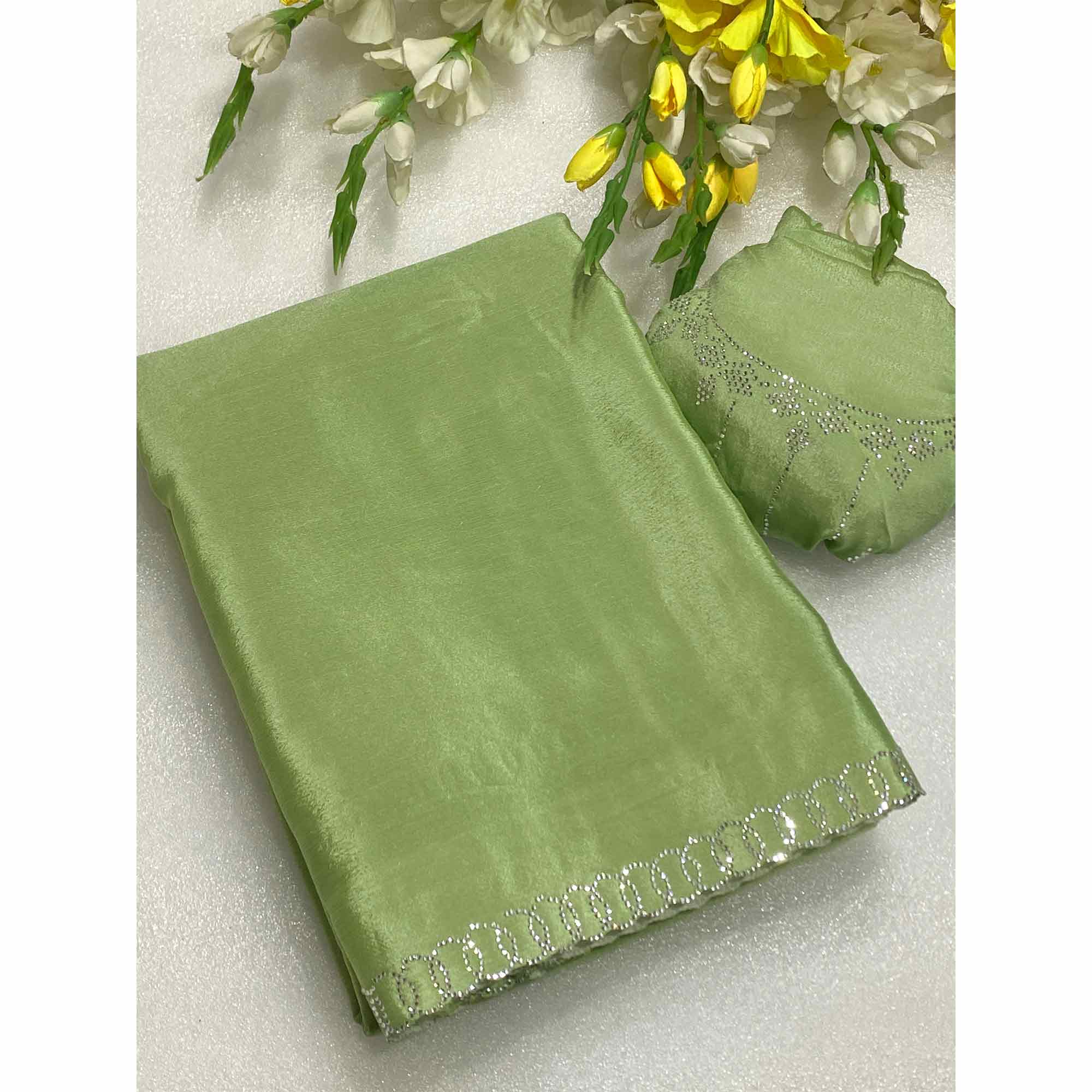 Green Embellished Silk Blend Saree Featuring Fine Swarovski Stone Detailing