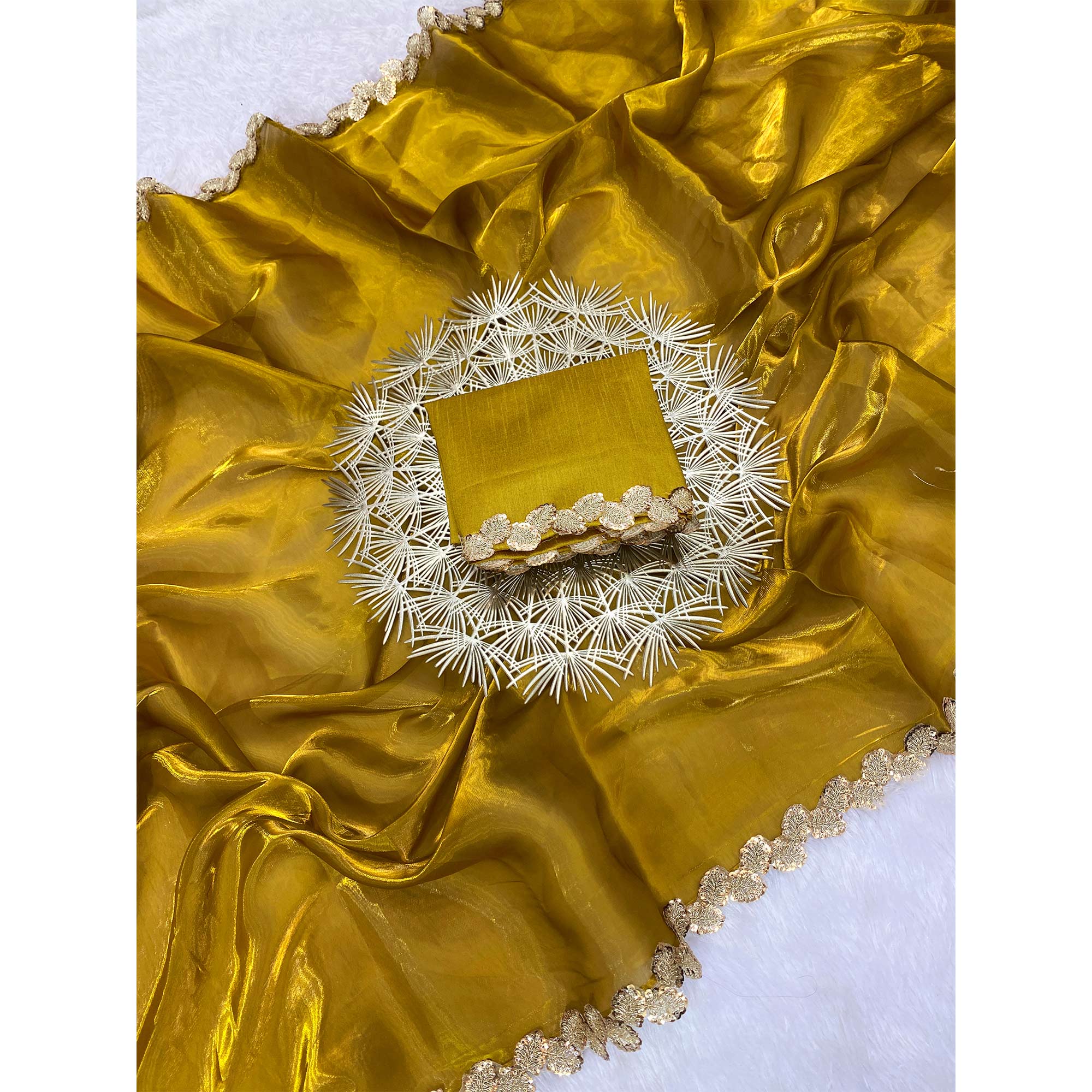 Gold Tissue Saree Featuring Solid Finish and Delicate Lace Work by Jimmy Choo Style