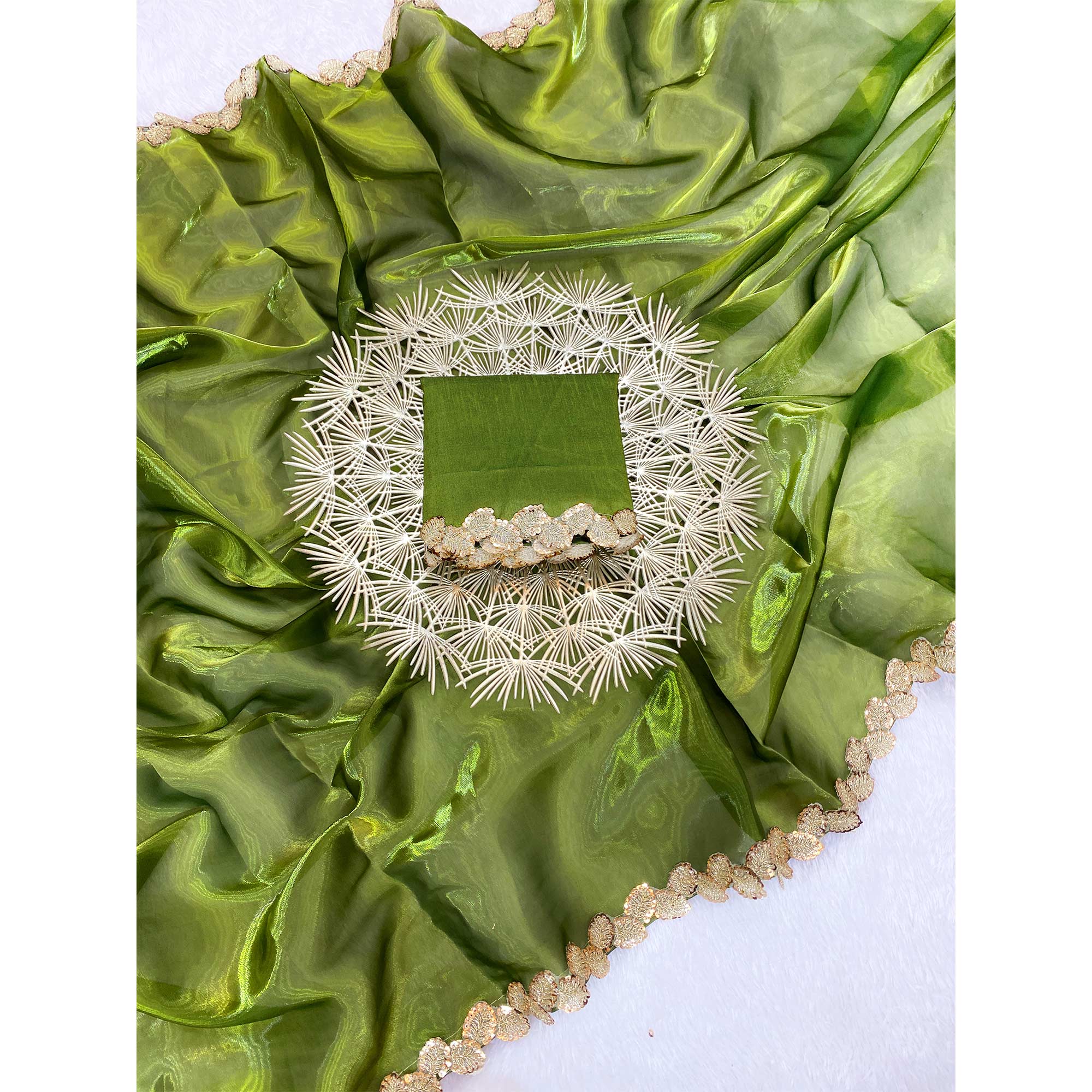 Green Tissue Saree Featuring Solid Finish and Delicate Lace Work by Jimmy Choo Style