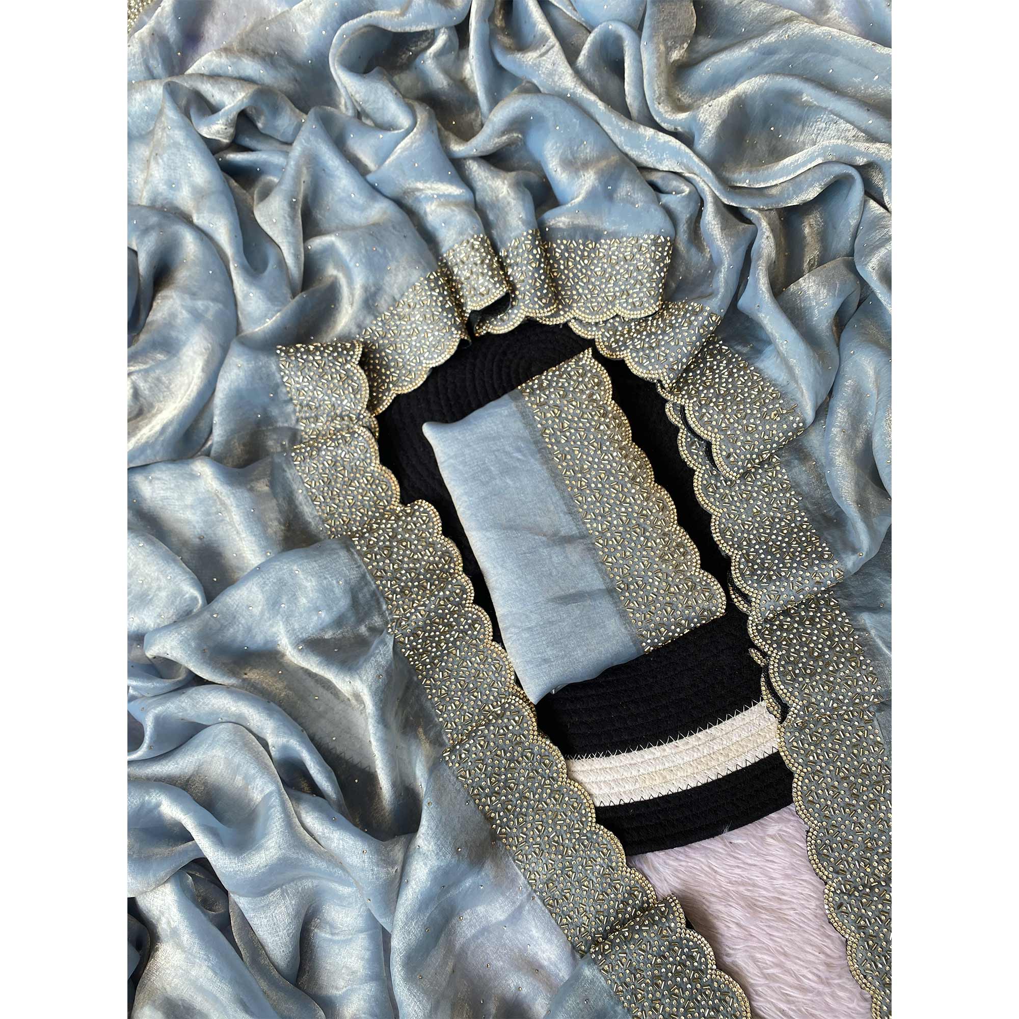 Greyish Blue Fandy Satin Saree Featuring Intricate Swarovski Work & Decorative Zarkan Border