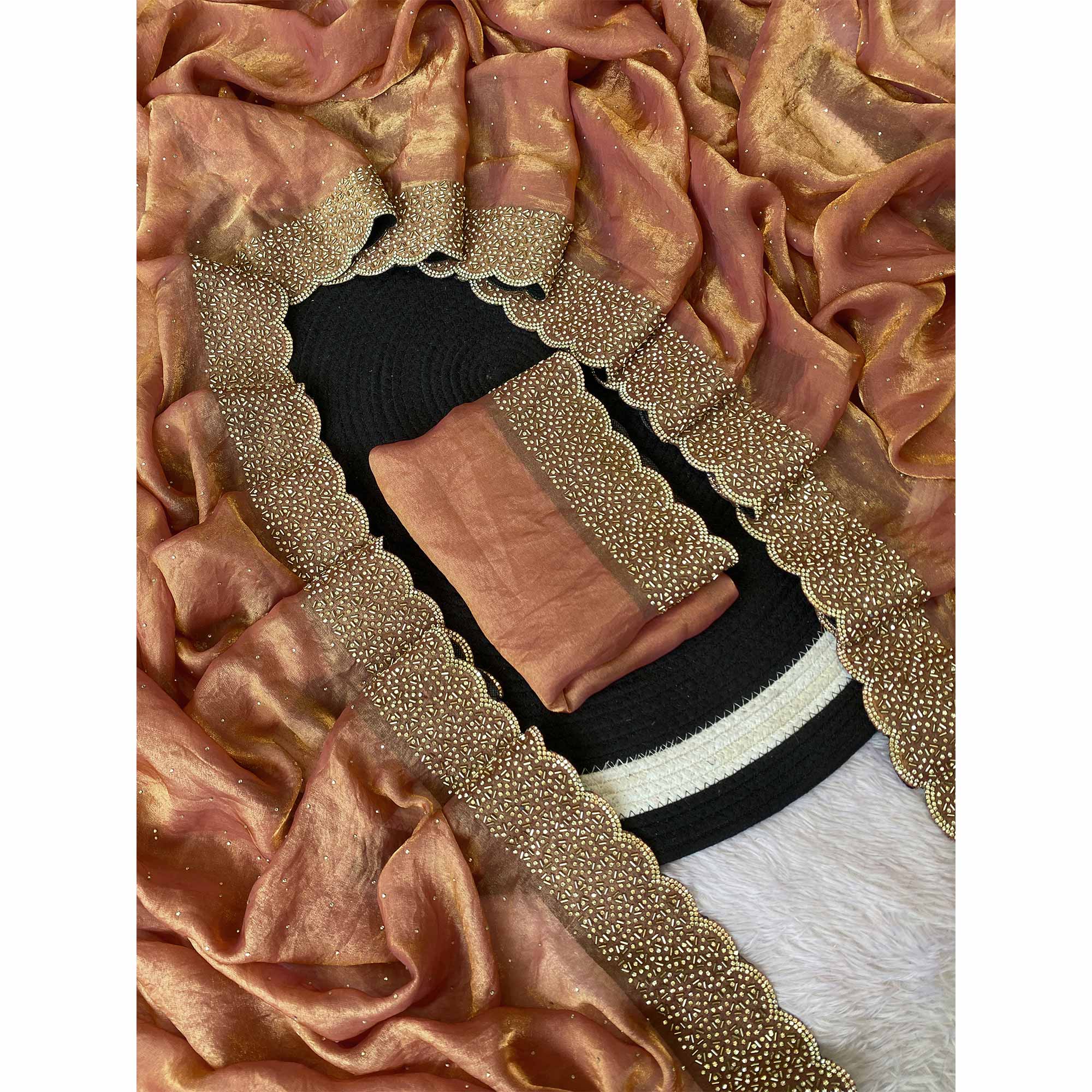 Peach Fandy Satin Saree Featuring Intricate Swarovski Work & Decorative Zarkan Border