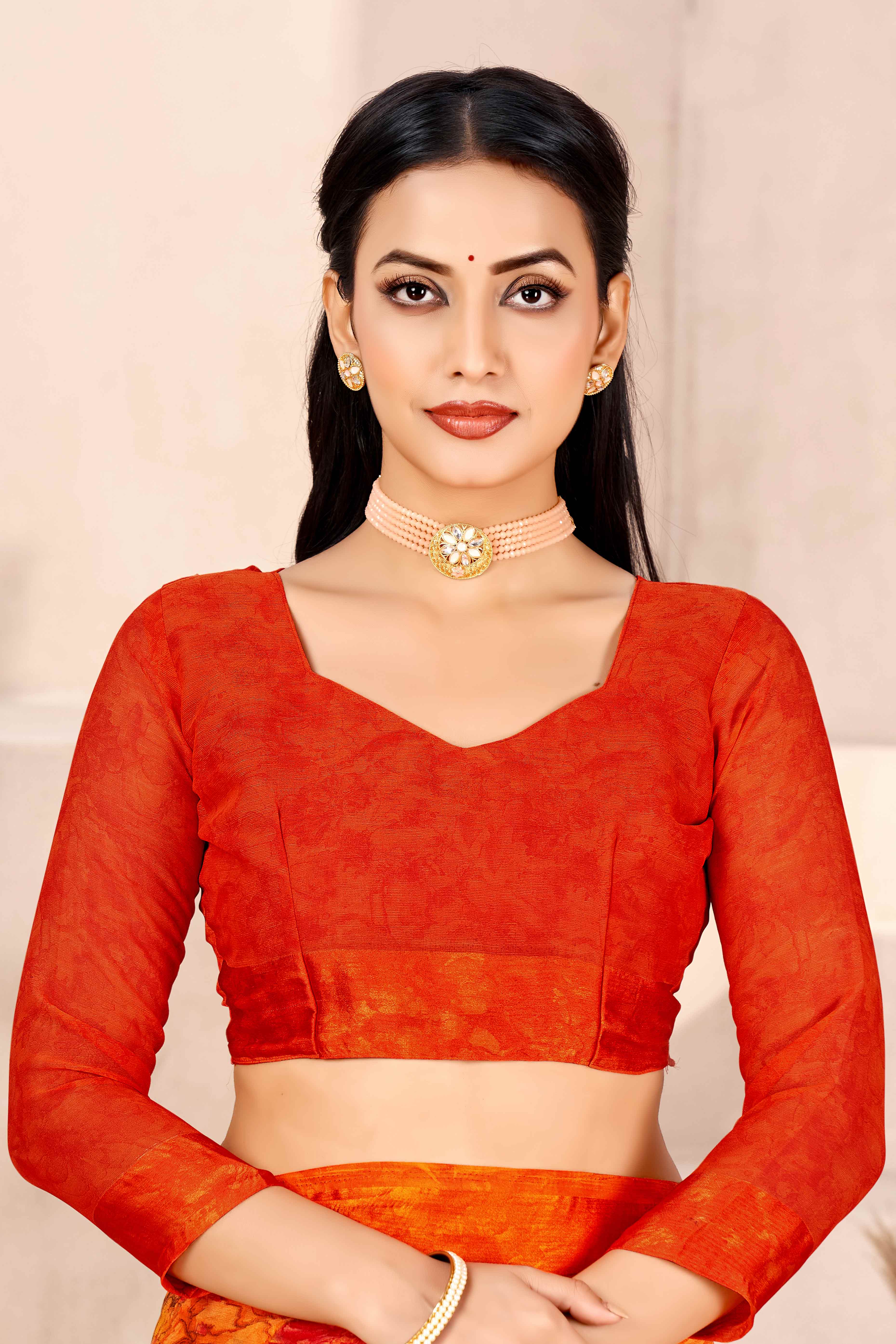 Orange Chiffon Saree With Delicate Floral Prints & Elegant Woven Border