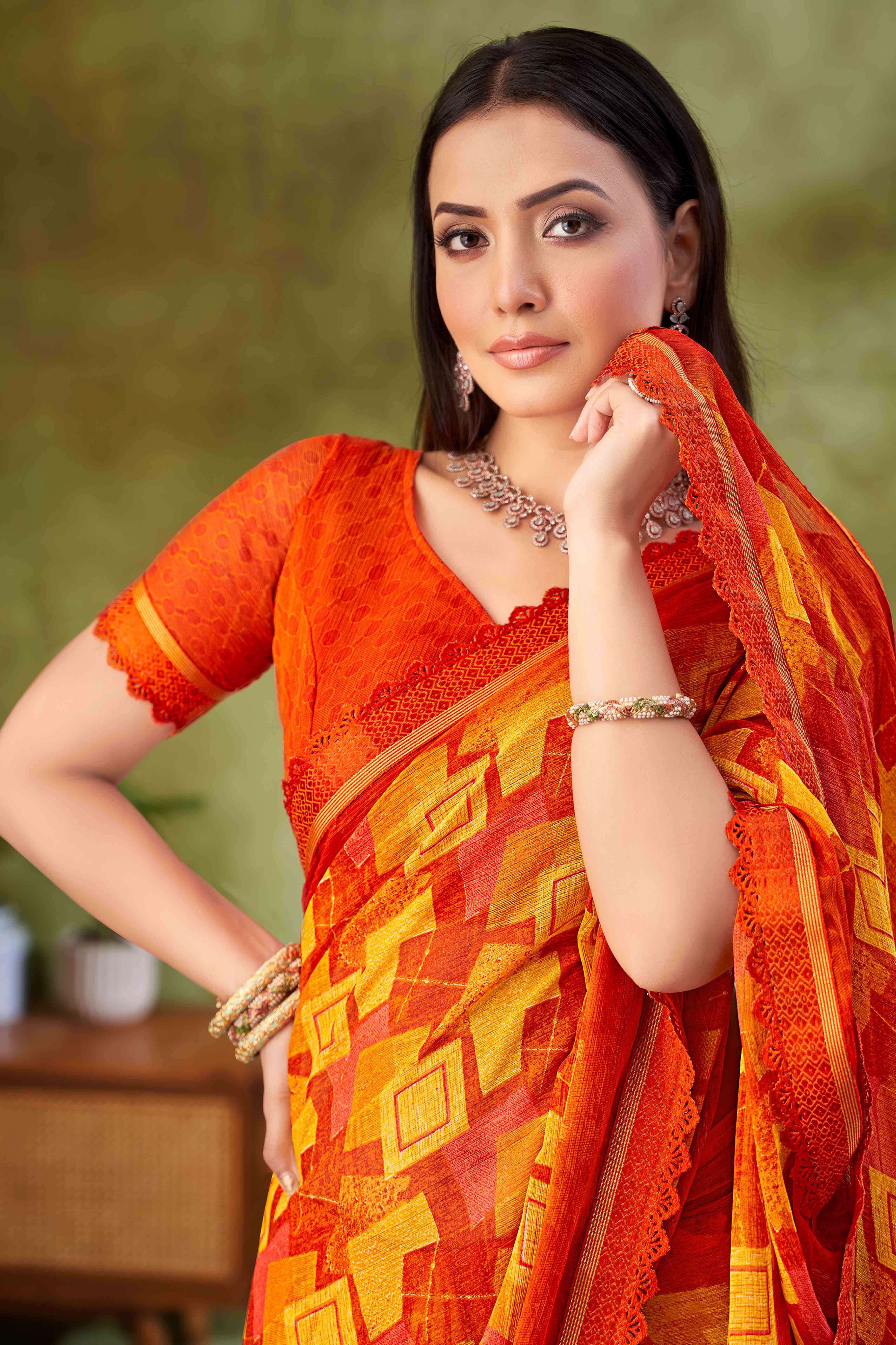 Orange Digital Printed Chiffon Saree Accented With Elegant Lace Border